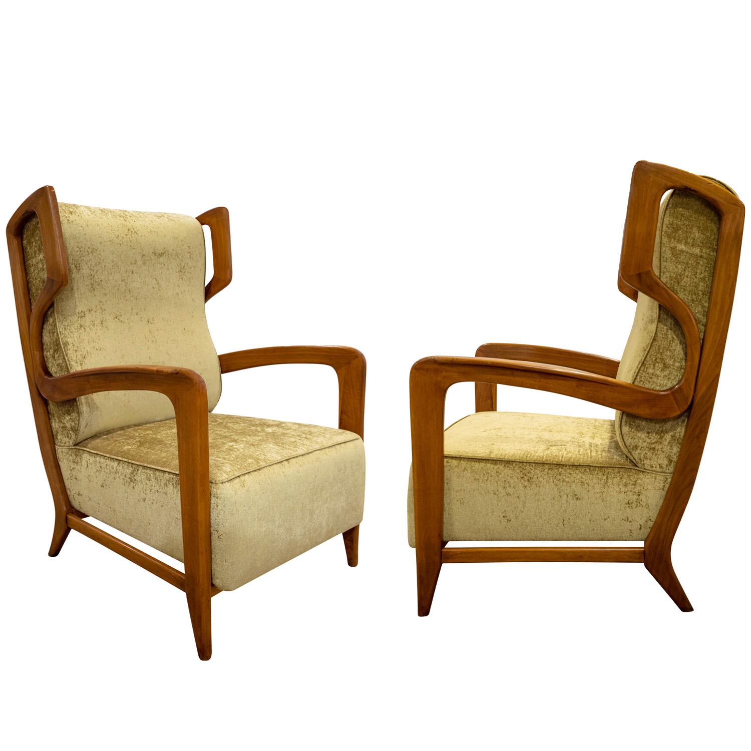 Rare and important pair of high back lounge chairs with wood frames and upholstered seats and backs by Gio Ponti and fabricated by Ariberto Colombo, Cantu, Italy 1940's. These chairs are beautifully made with exceptional attention paid to every