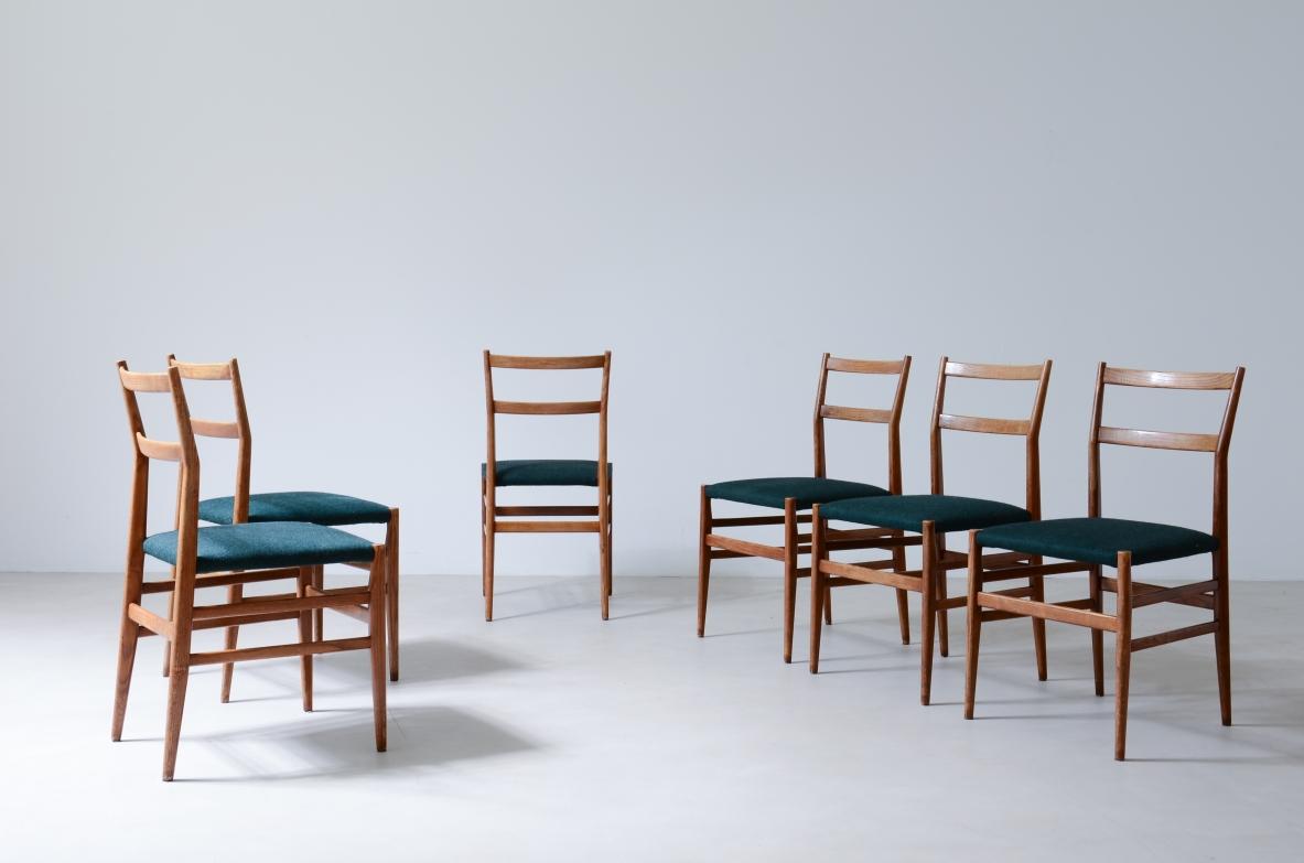 COD-2525
Gio Ponti

Set of 6 chairs in black stained wood with fabric covering.

Modello leggera,

Cassina manufacture 1954.