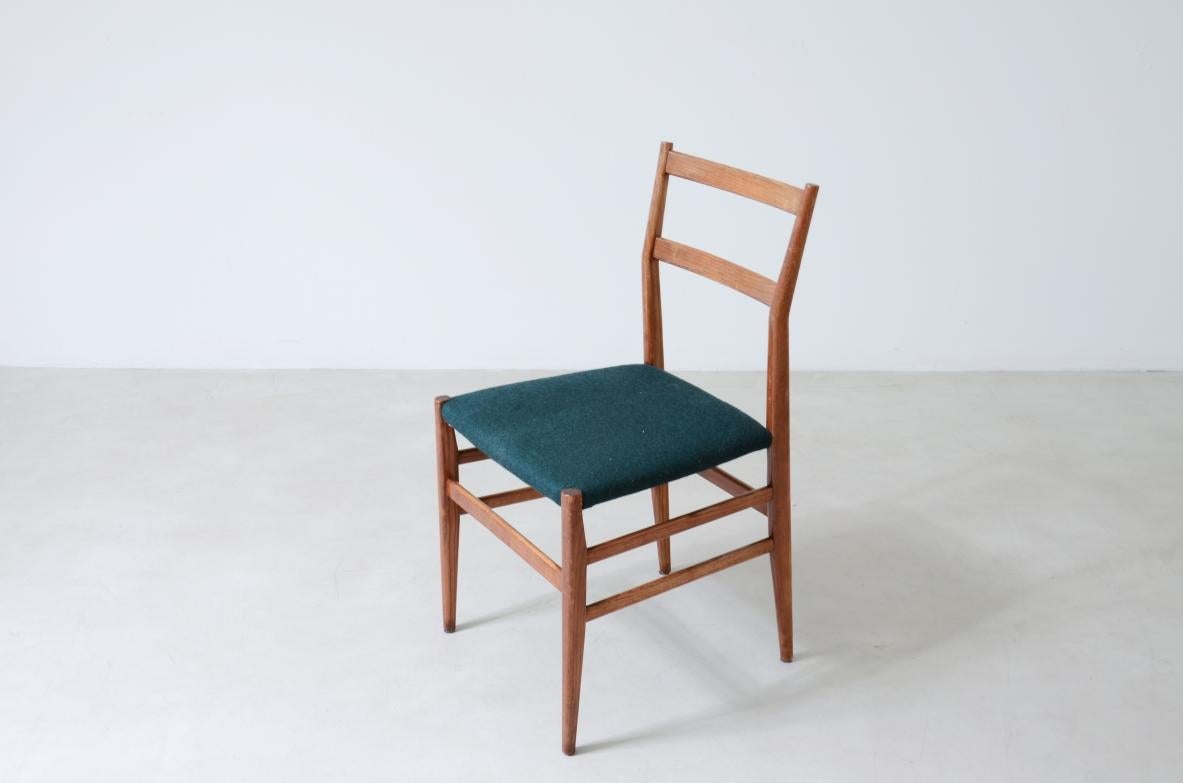 Italian Gio Ponti set of 6 chairs in wood with fabric covering. For Sale