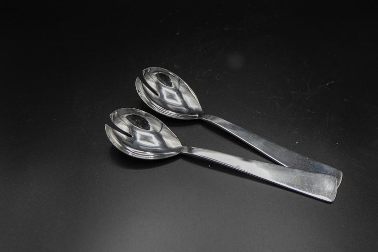 Set of four chrome-plated steel tableware designed by Gio Ponti in the 1950s, from the fine Italian manufacturer Krupp Italia.
The set consists of four forks, four knives, four spoons, four dessert forks, four teaspoons, and two serving or salad