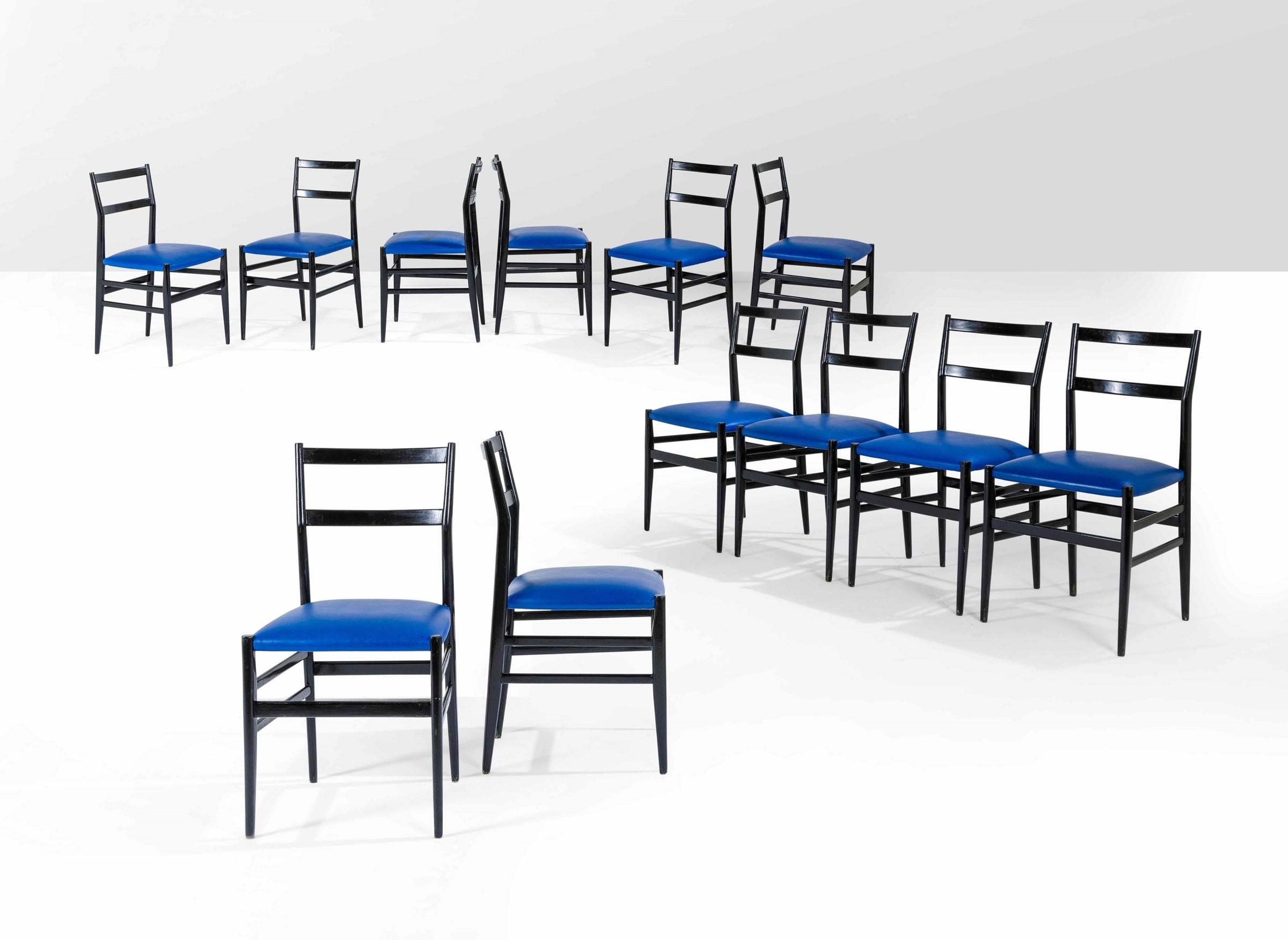 Gio Ponti set of twelve chairs Leggera in lacquered wood and blue skai.
Prod. Cassina, Italy, 1951
Measures: cm 43 x 46 x 83
Literature: Domus n. 264-265, December 1951.