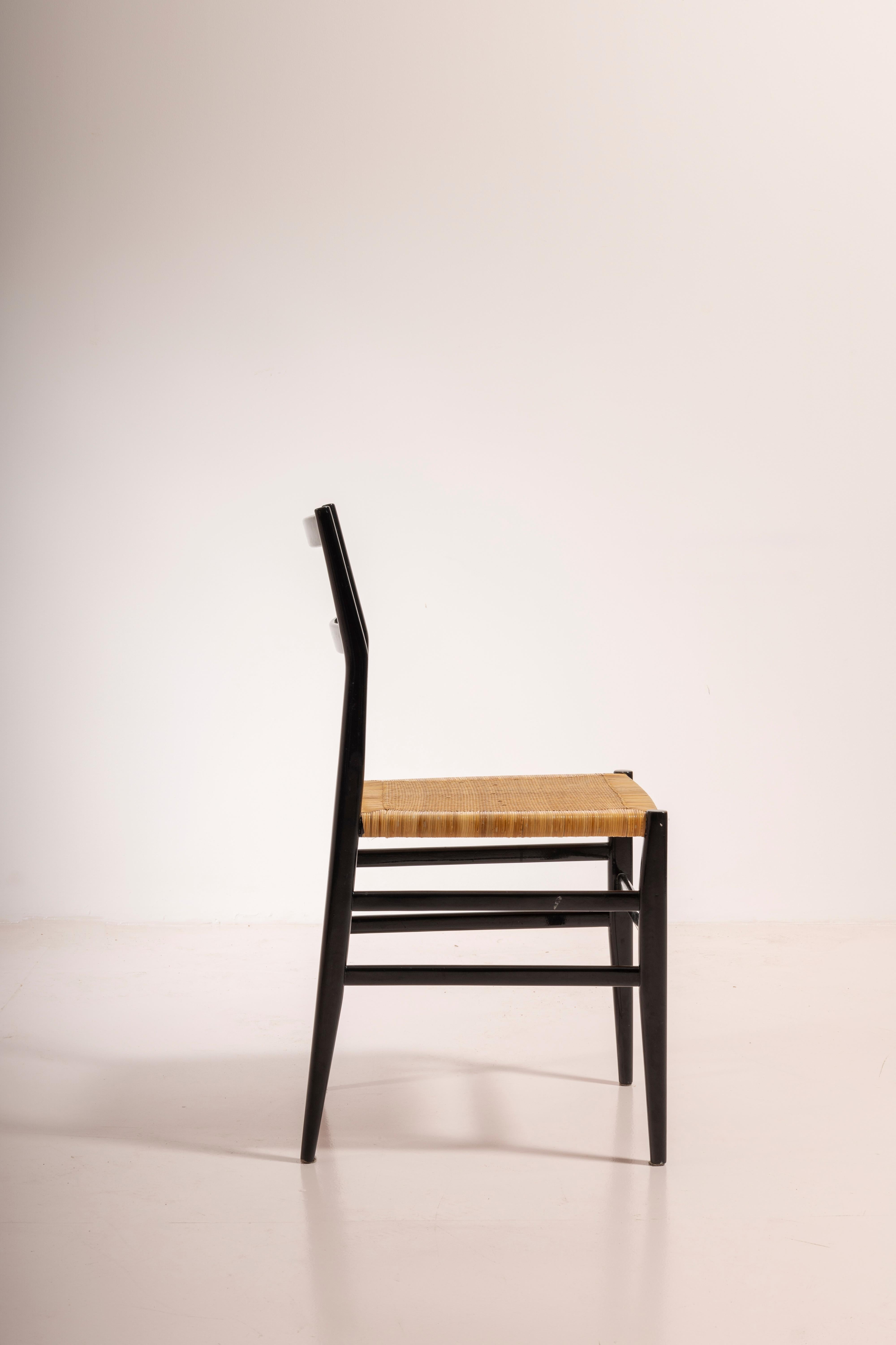 Mid-20th Century Gio Ponti set of twelve Leggera chairs with hand-woven rattan cane, Italy 1951 For Sale