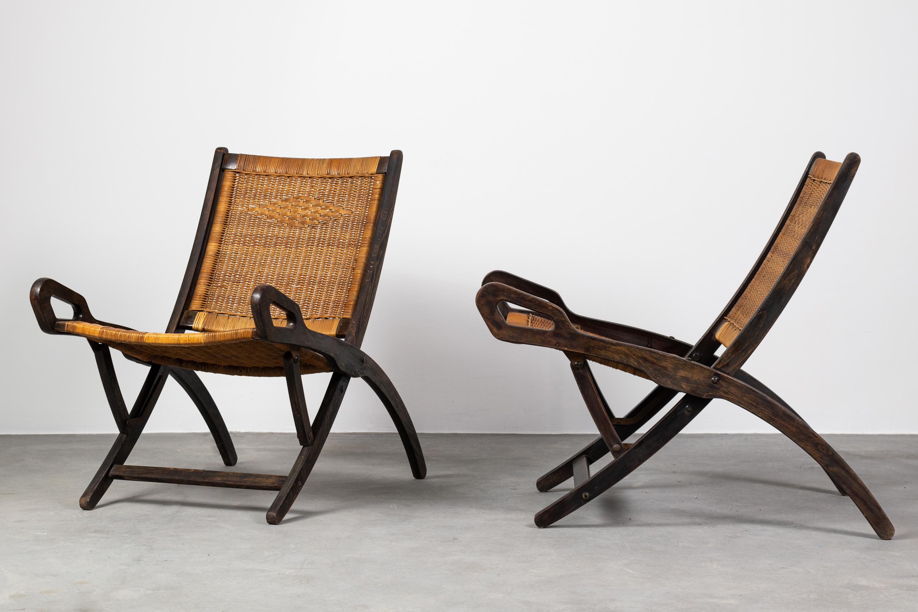 Set of two folding lounge chairs Ninfea (or Pieghevole Ninfea) with a structure in the wood, seat, and back in woven wicker and brass hinges.
The Ninfea chair was designed by Gio Ponti during the progettation of the iconic Superleggera chair and