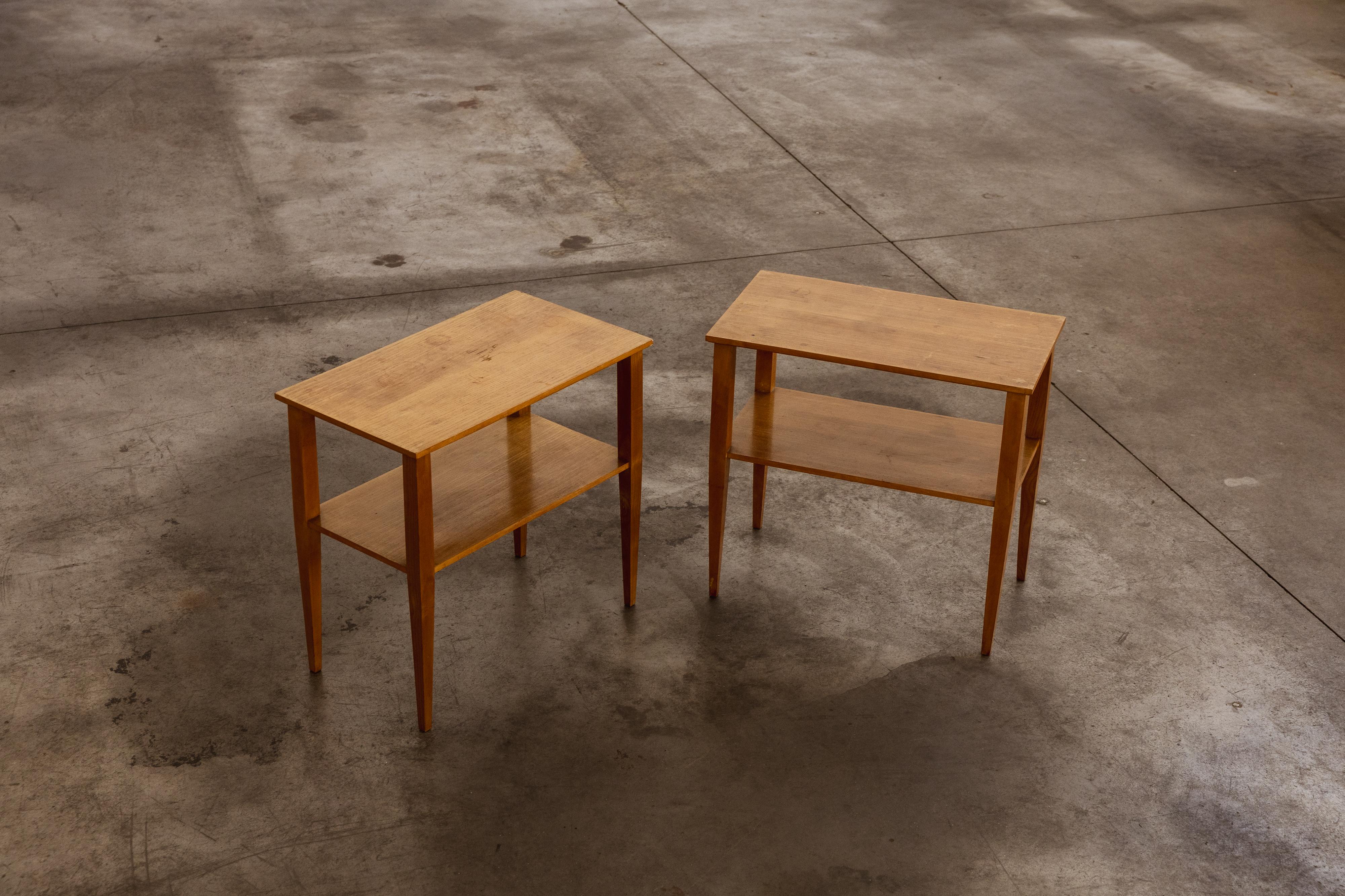 Gio Ponti side tables, wood, Italy, 1950s, set of 2

Pair of side tables designed by Gio Ponti in the 1950s, featuring an elegant and essential construction. Each table is crafted in light-stained wood, with a rectangular top, tapered legs, and an