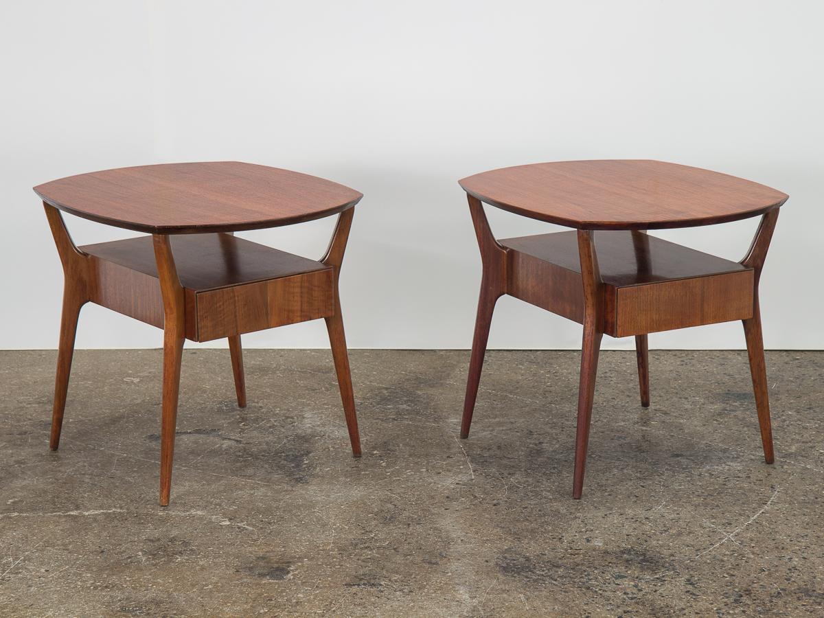 Pair of end tables made by Singer and Sons, widely attributed to Italian designer and architect Gio Ponti. Beautifully figured Italian walnut wood selection with lacquered finish. Finely crafted, with a gently angular silhouette and splayed, pointed