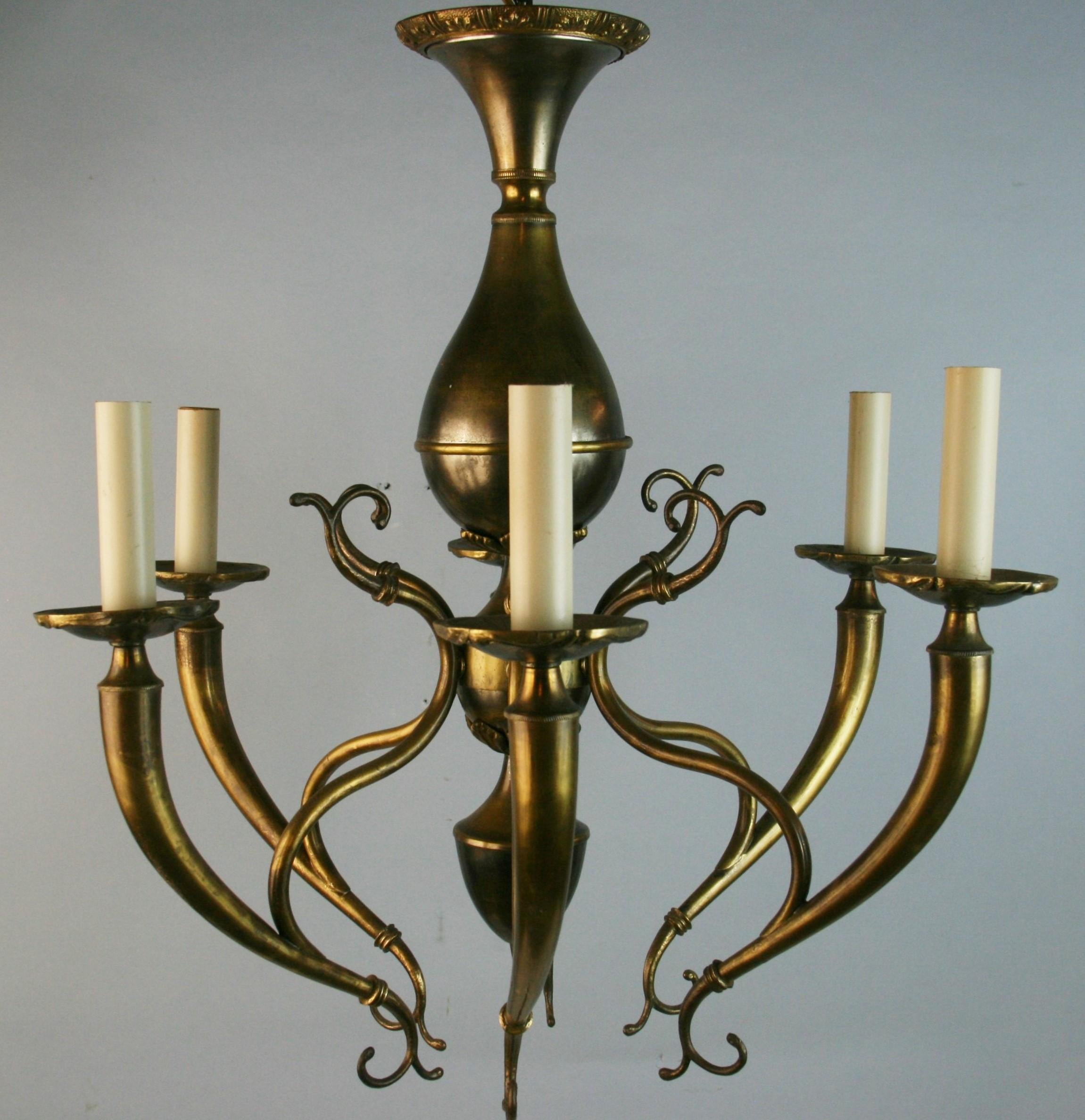 #1-4003 Italian scrolled six-arm chandelier in brass with silver highlights.
 