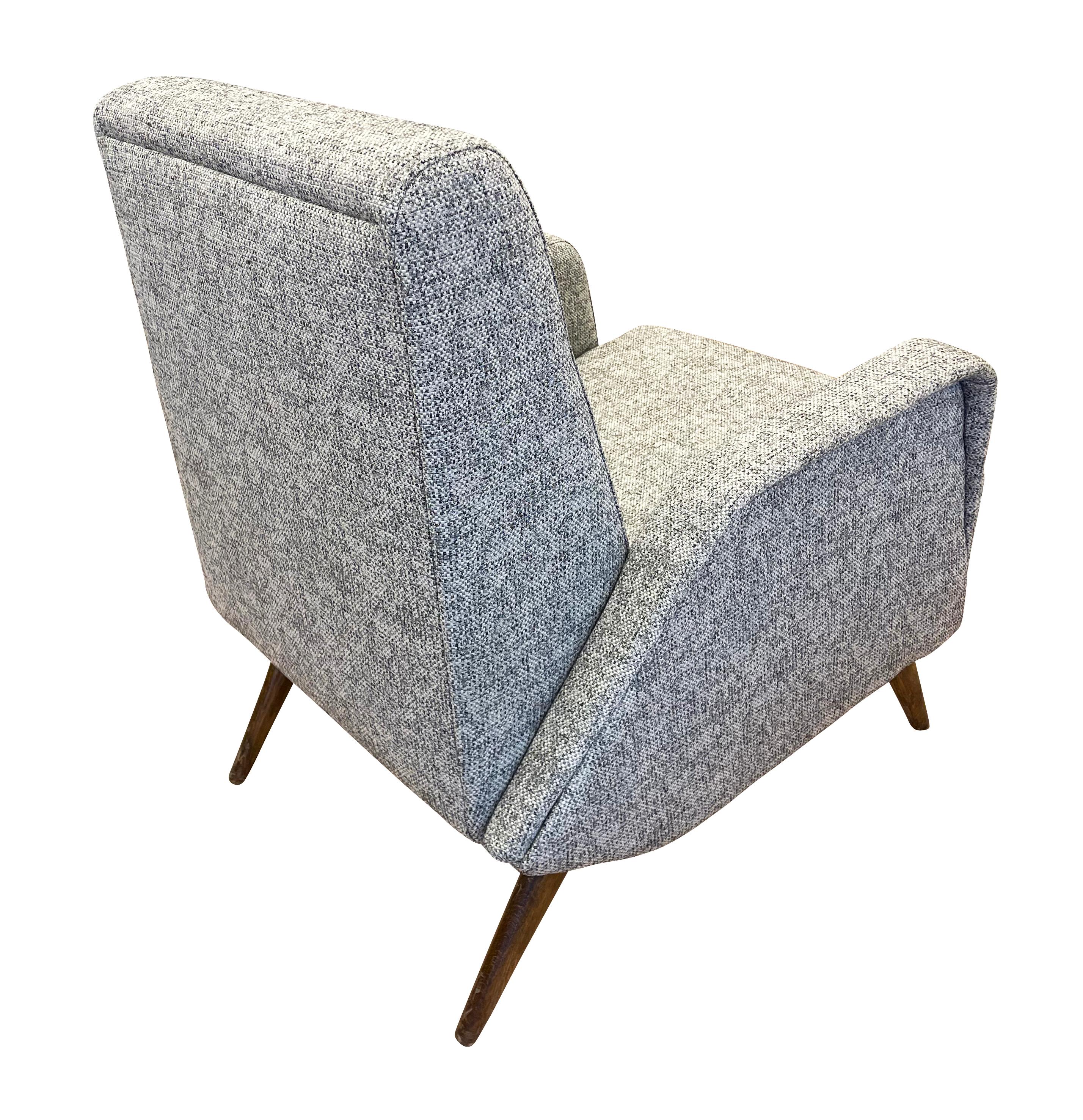 Italian mid-century armchair in the style of Gio Ponti. Wood legs. Recovered in a gray fabric.

Condition: Recovered, minor wear to the legs consistent with age and use

Measures: Width: 26.5”

Depth: 30”

Height: 32”

Seat height: