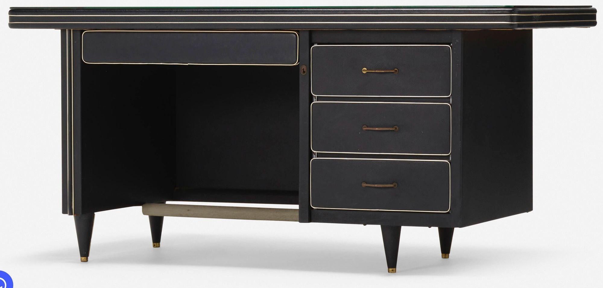 Gio Ponti–Style Mid-Century Modern Italian Desk, 1955
Italy, 1955
Striking Italian desk in the manner of Gio Ponti, featuring a black vinyl-clad top and sides with refined brass accents. The minimalist yet sculptural form is characteristic of