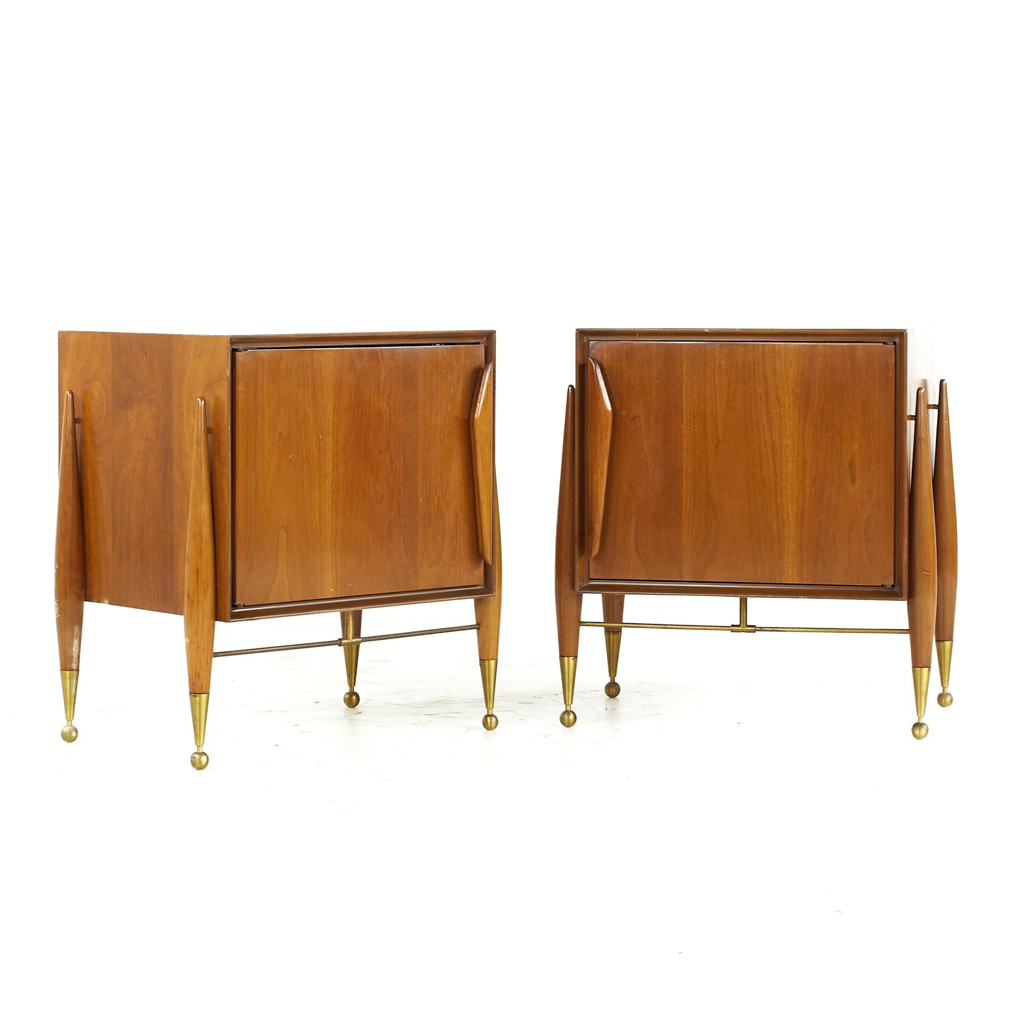 Gio Ponti Style midcentury Walnut and Brass Nightstand - Pair

Each nightstand measures: 23.25 wide x 17 deep x 24.5 inches high

All pieces of furniture can be had in what we call restored vintage condition. That means the piece is restored