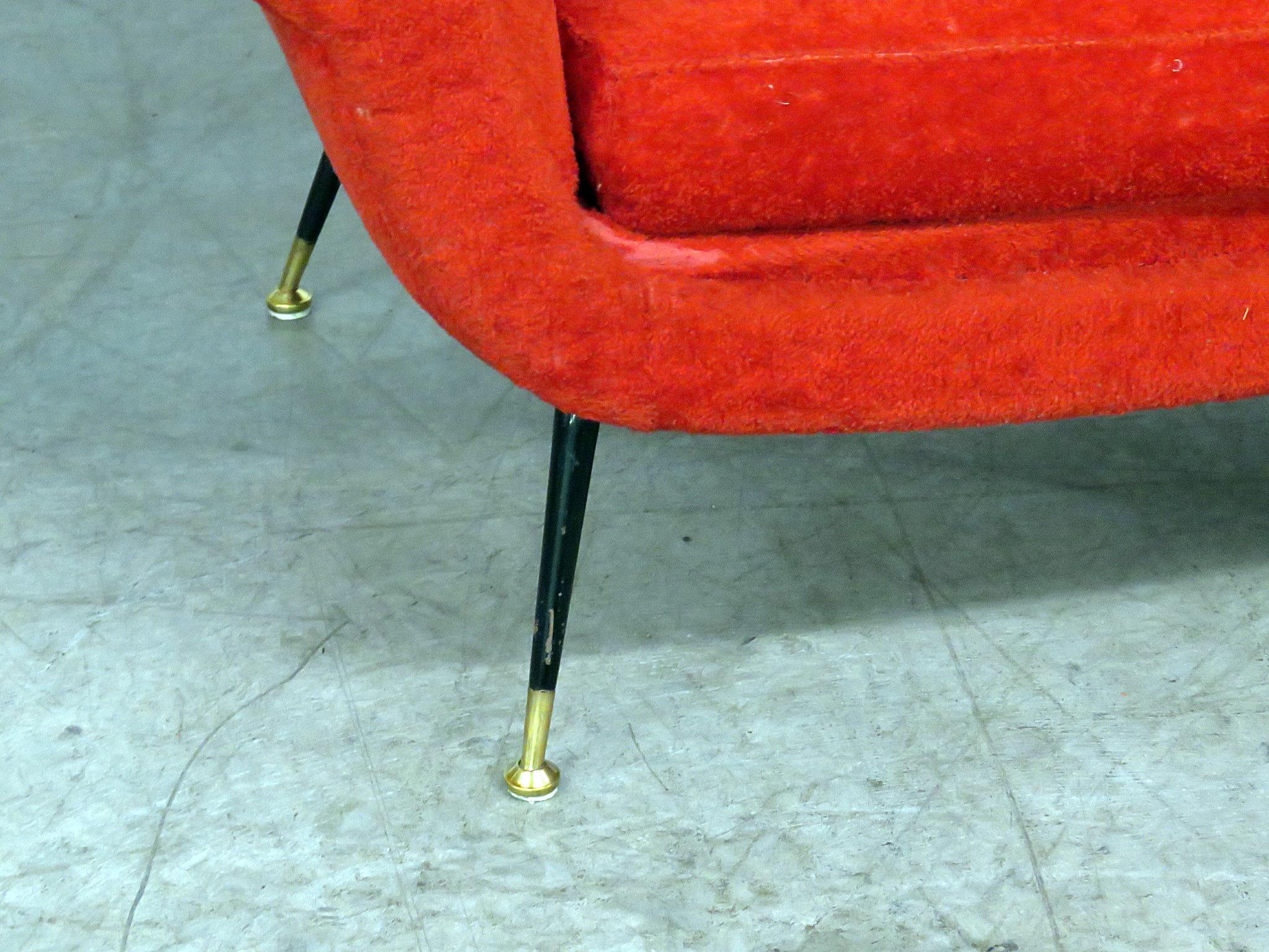 Gio Ponti style sofa with metal legs and brass sabots.