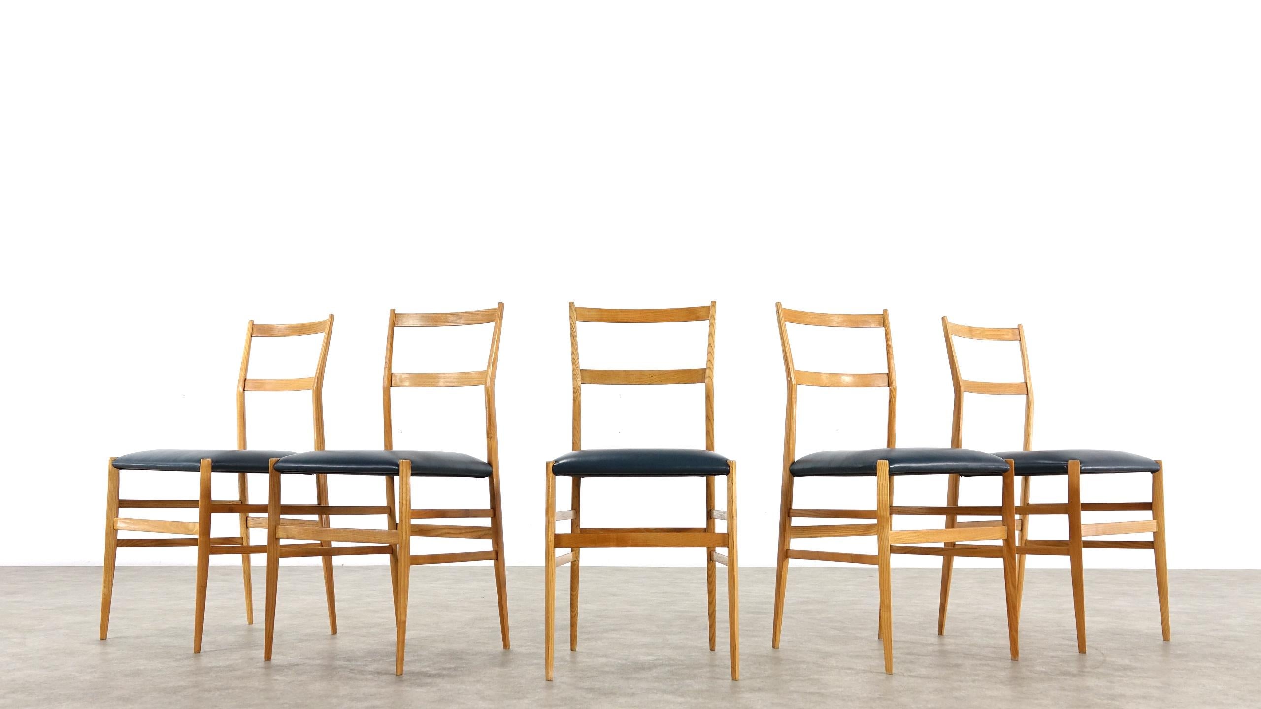 A early authentic set of five Gio Ponti Superleggera leather dining chairs by Cassina, Italy, 1958. This rare beautiful set is in good vintage condition two chairs have been restored please look as seen in the pictures.