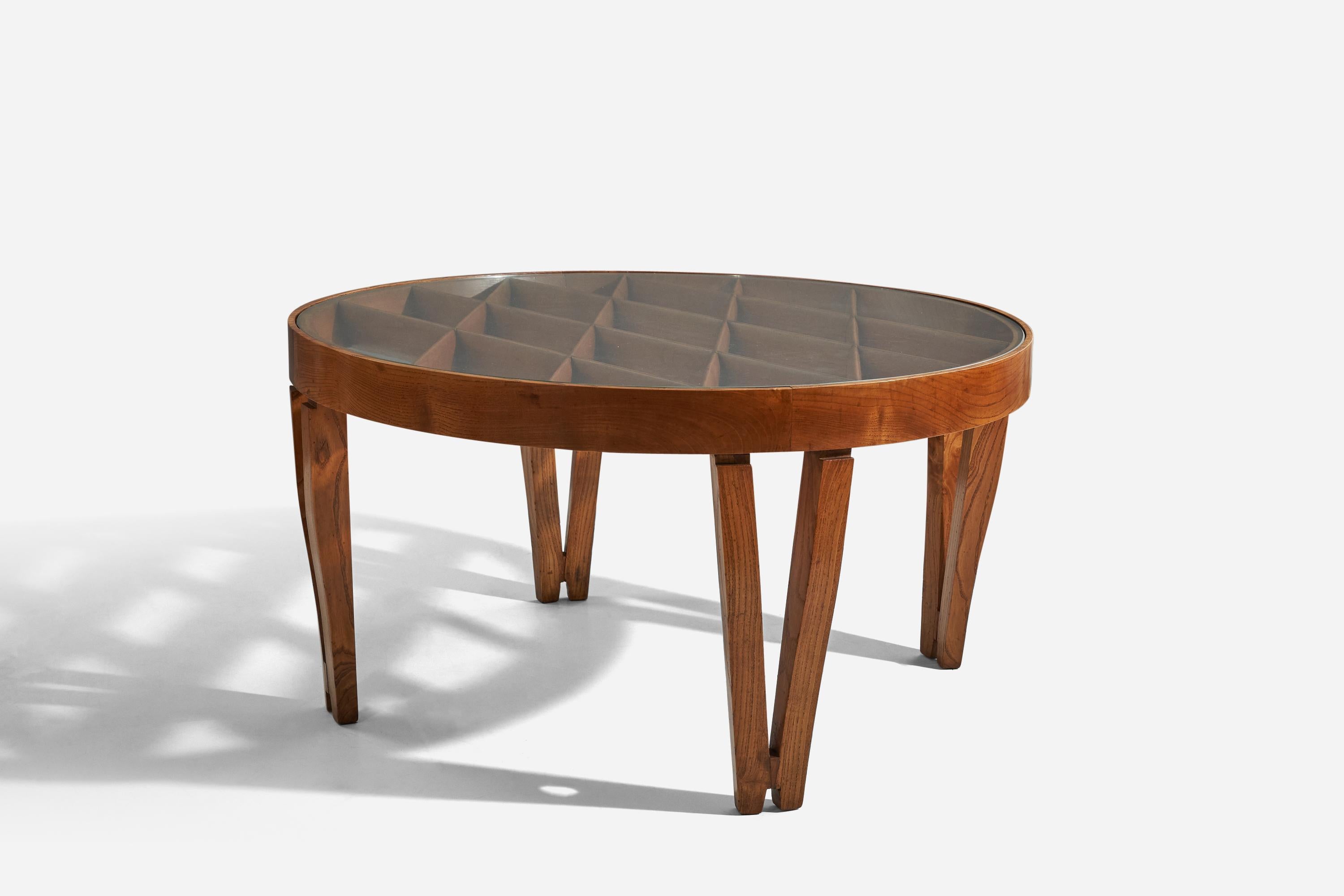 A unique, oak and glass coffee table designed by Gio Ponti and possibly executed by Giordano Chiesa, Milan, Italy, circa 1937. 

Sold with a certificate of expertise from the Gio Ponti Archives.