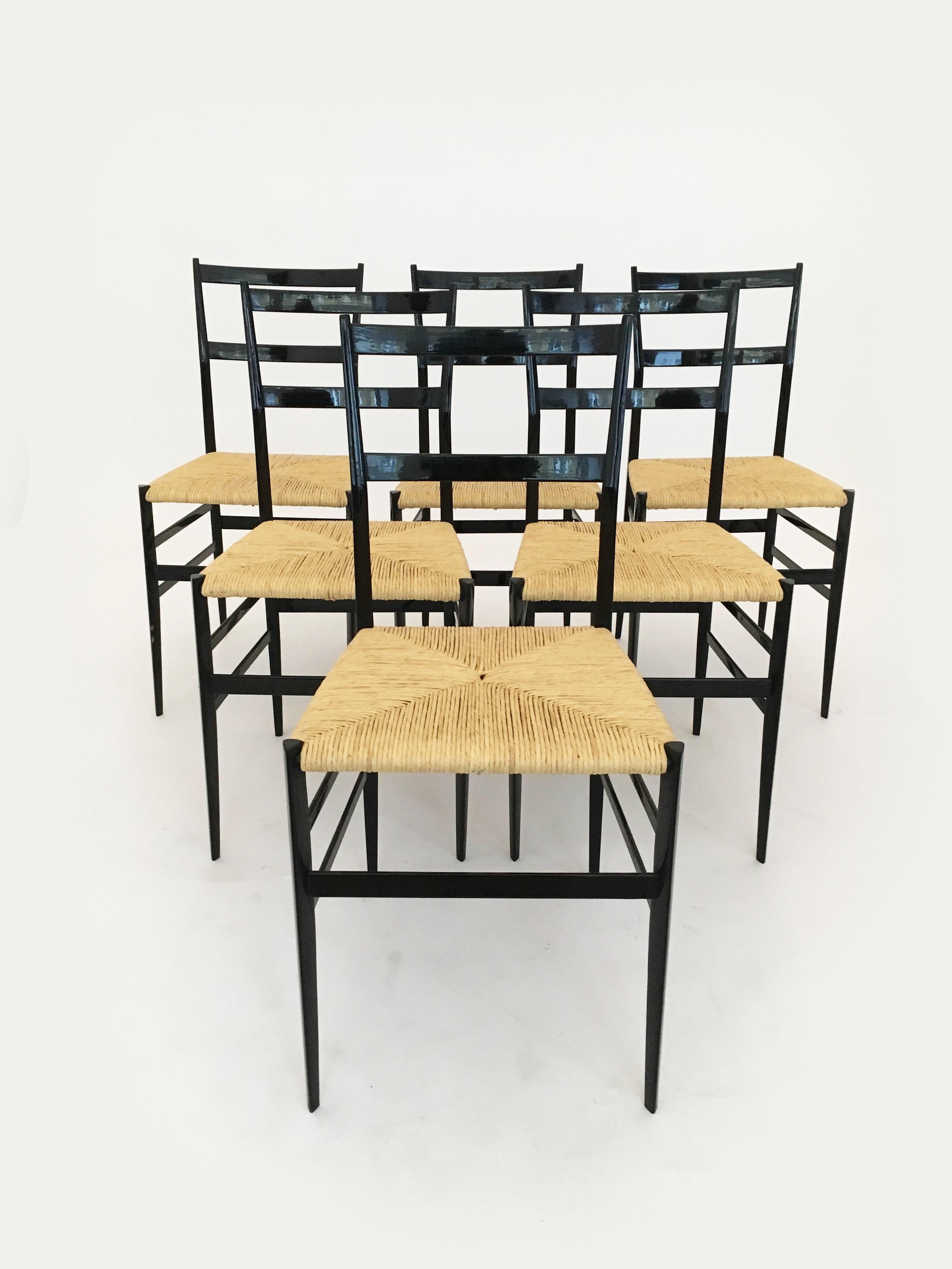 Delightful very early set of six vintage Gio Ponti Superleggera dining chairs by Cassina, Italy, 1958. We can pinpoint the date of production, because the inside of the frame is each stamped with the day of manufactur: 25 FEB. 1958. The Superleggera