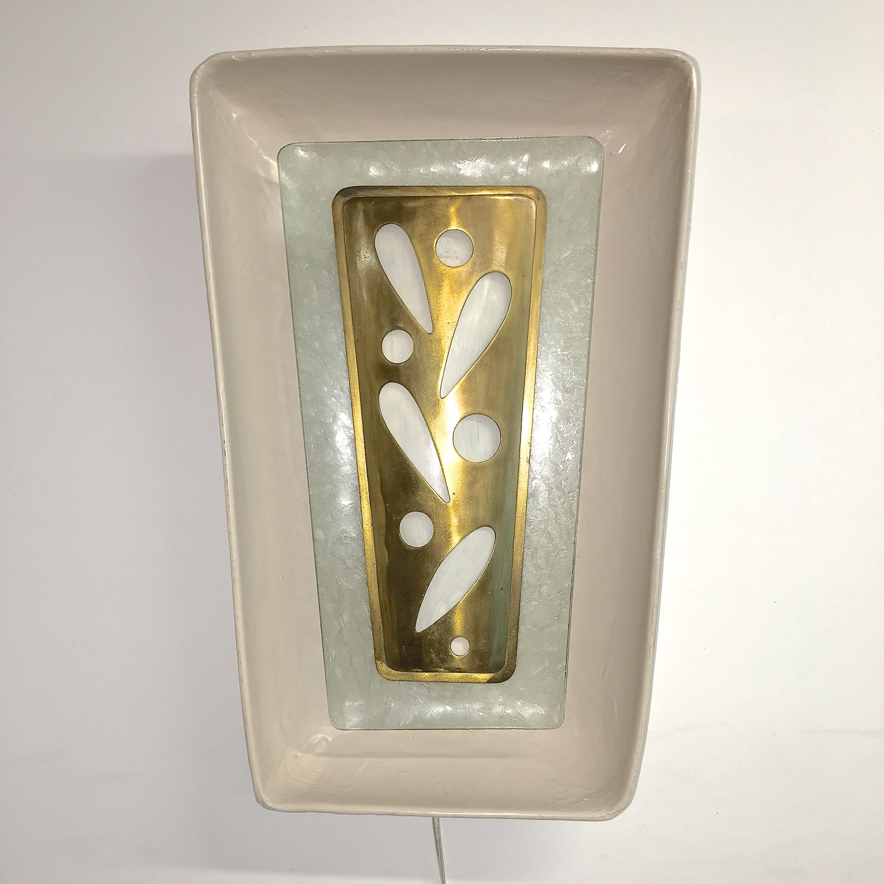 Trapezoidal shaped wall mounted niche-form light fixture designed by Gio Ponti for the m/s Augustus transatlantic ocean liner.
From the Atlantico, tourist class dining room aboard the Augustus. We previously sold one of the large round ceiling