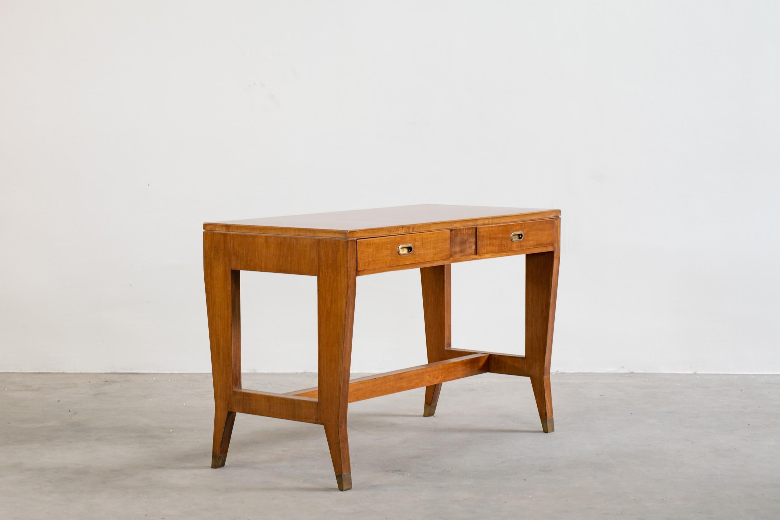 Executive desk with two frontal drawers, with structure in walnut wood, top in laminate and brass details (handles and feet) designed by Gio Ponti for the offices of BNL (Banca Nazionale del Lavoro) and manufactured by the Italian Company Schirolli