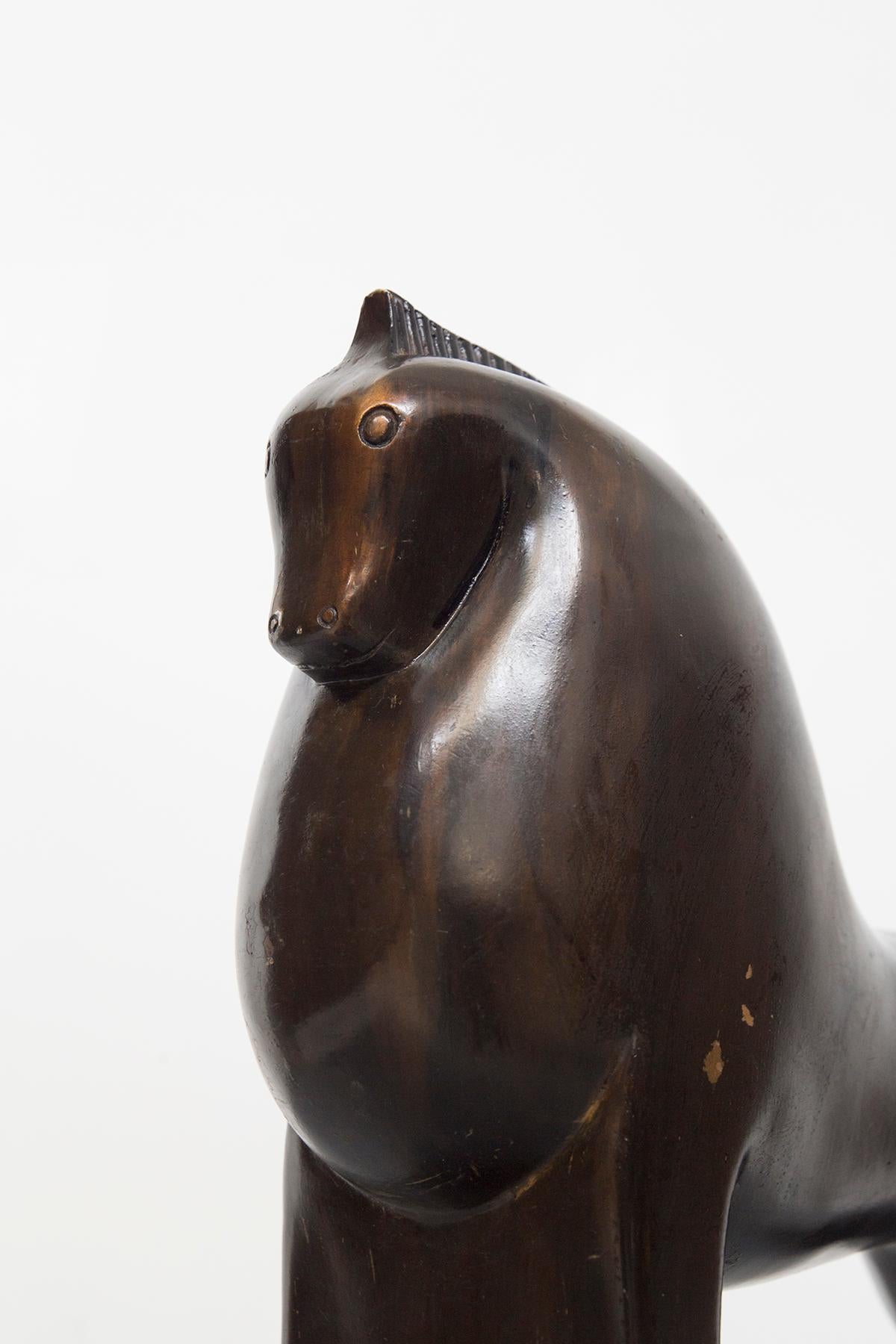 Splendid wooden sculpture attributed to the great Gio Ponti in the 1920s, fine Italian manufacture.
The sculpture is made entirely of solid dark wood, very elegant and is in the form of a horse.
The four legs are joined two by two, the front one is