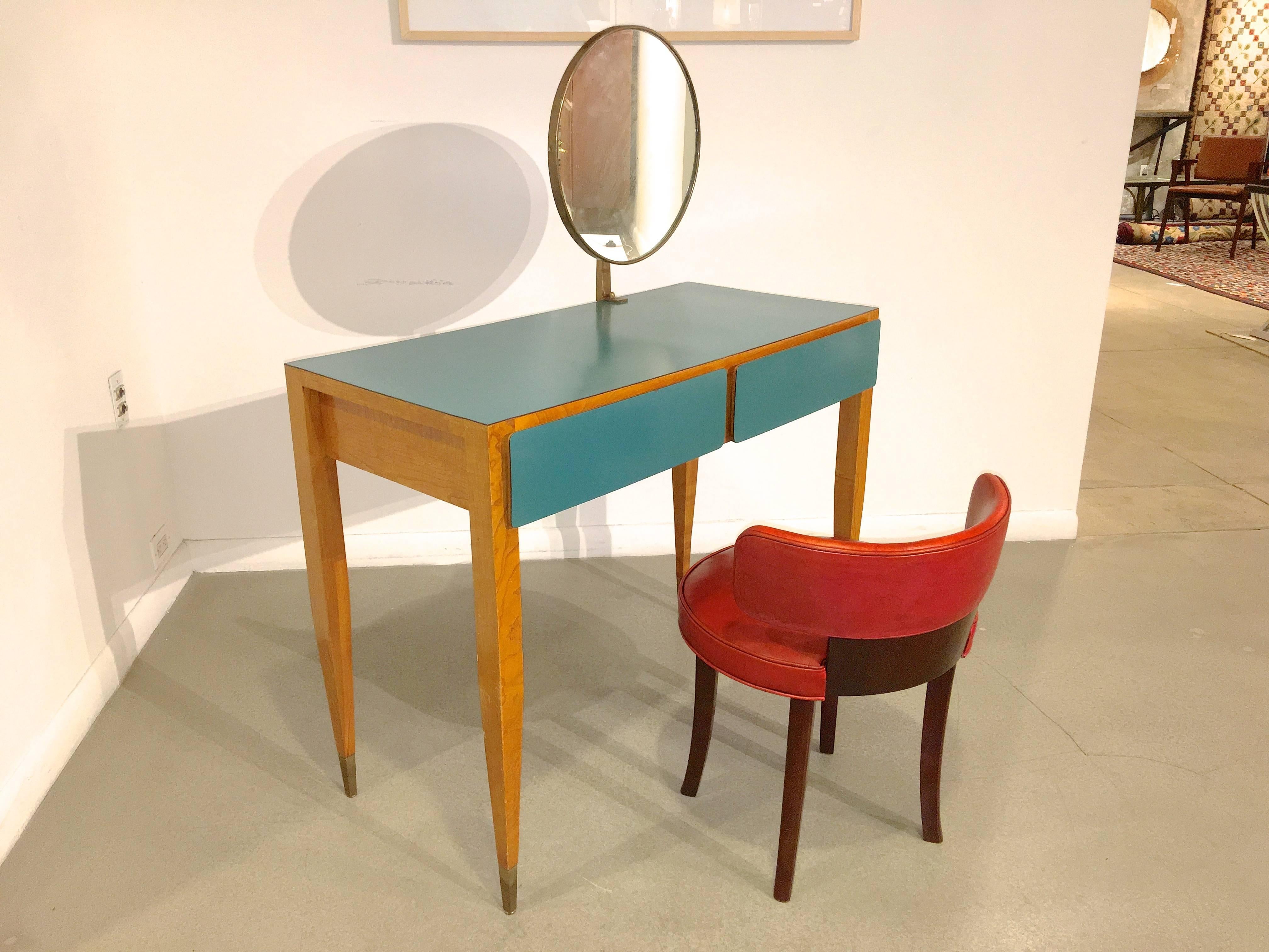 Vanity dressing table with adjustable gilt bronze framed Fontana Arte round mirror and brass sabots, by Gio Ponti from the Parco dei Principi Hotel, Rome, Italy, ca. 1964.
Inscribed in pencil to underside 'Camera 103' 
Manufacturer: Giordano Chiesa