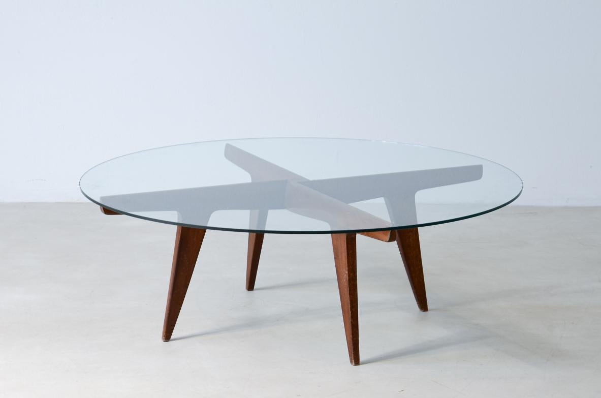 COD-2535
Gio Ponti (1991-1979)

Rare four crossed wooden spokes coffee table with glass top.

1950s manufacturing.

Authentication certificate from the Ponti archive.

105xh39