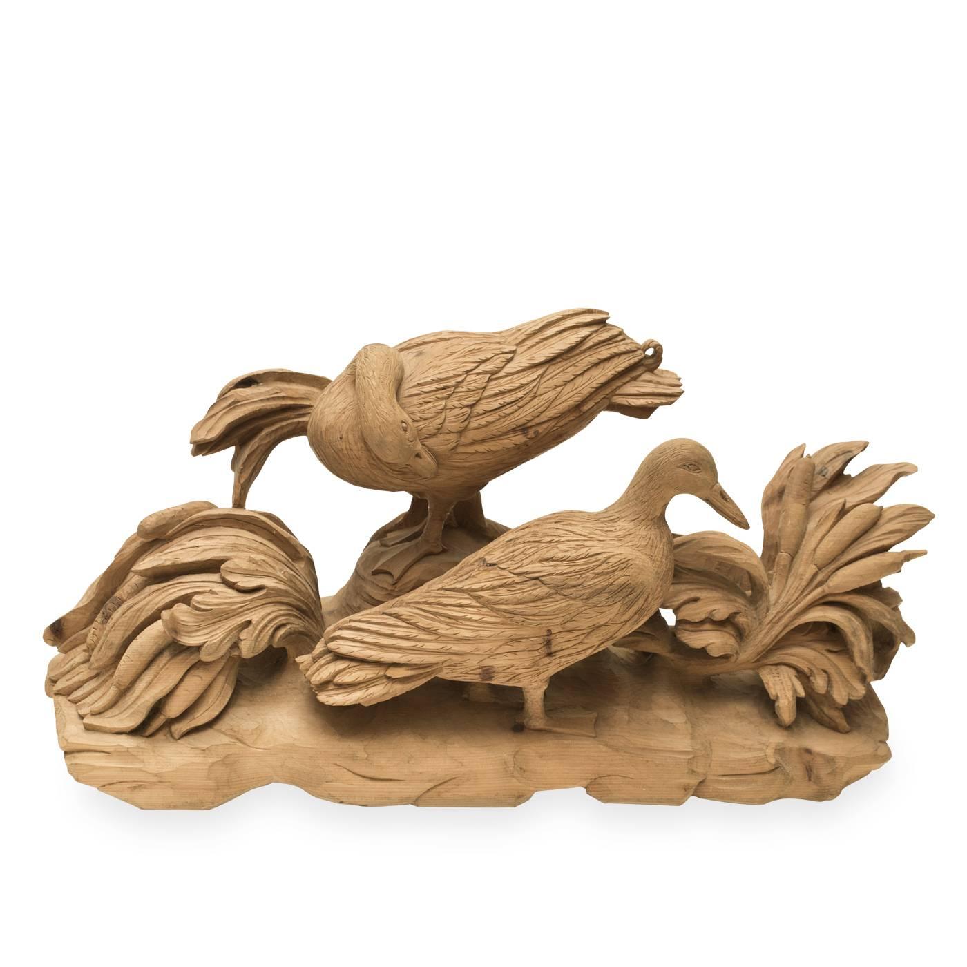 This entirely hand-carved sculpture by Bartolozzi e Maioli exhibits two graceful birds engaged in a natural environment. The unique piece, in Austrian pine, was originally designed for an architecture studio in the 1980s.