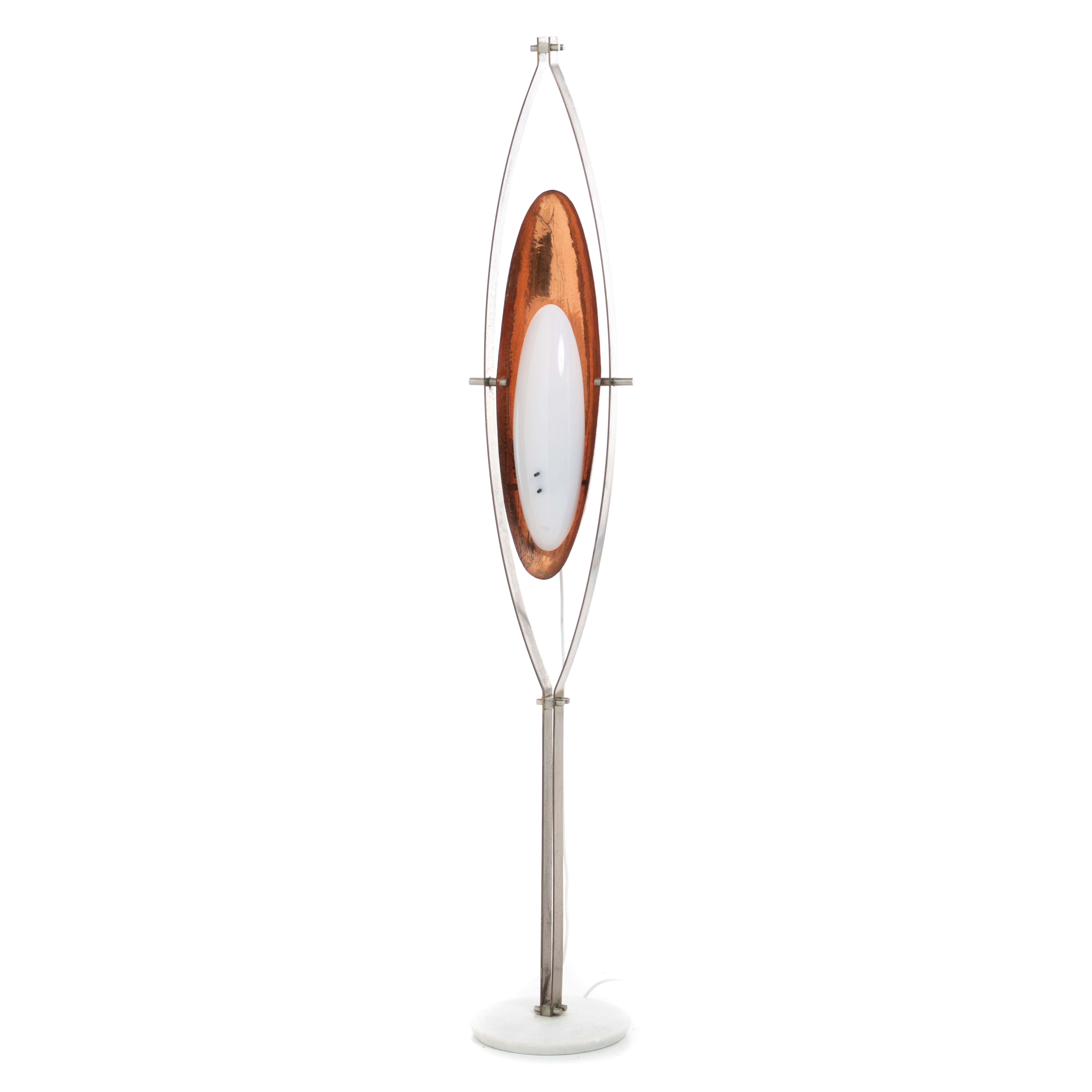 An Italian sculptural floor lamp, c.1960, made of chromed metal frame, leaf shaped hammered copper and plexiglass shade, marble base. Fitted for electricity, european plus.