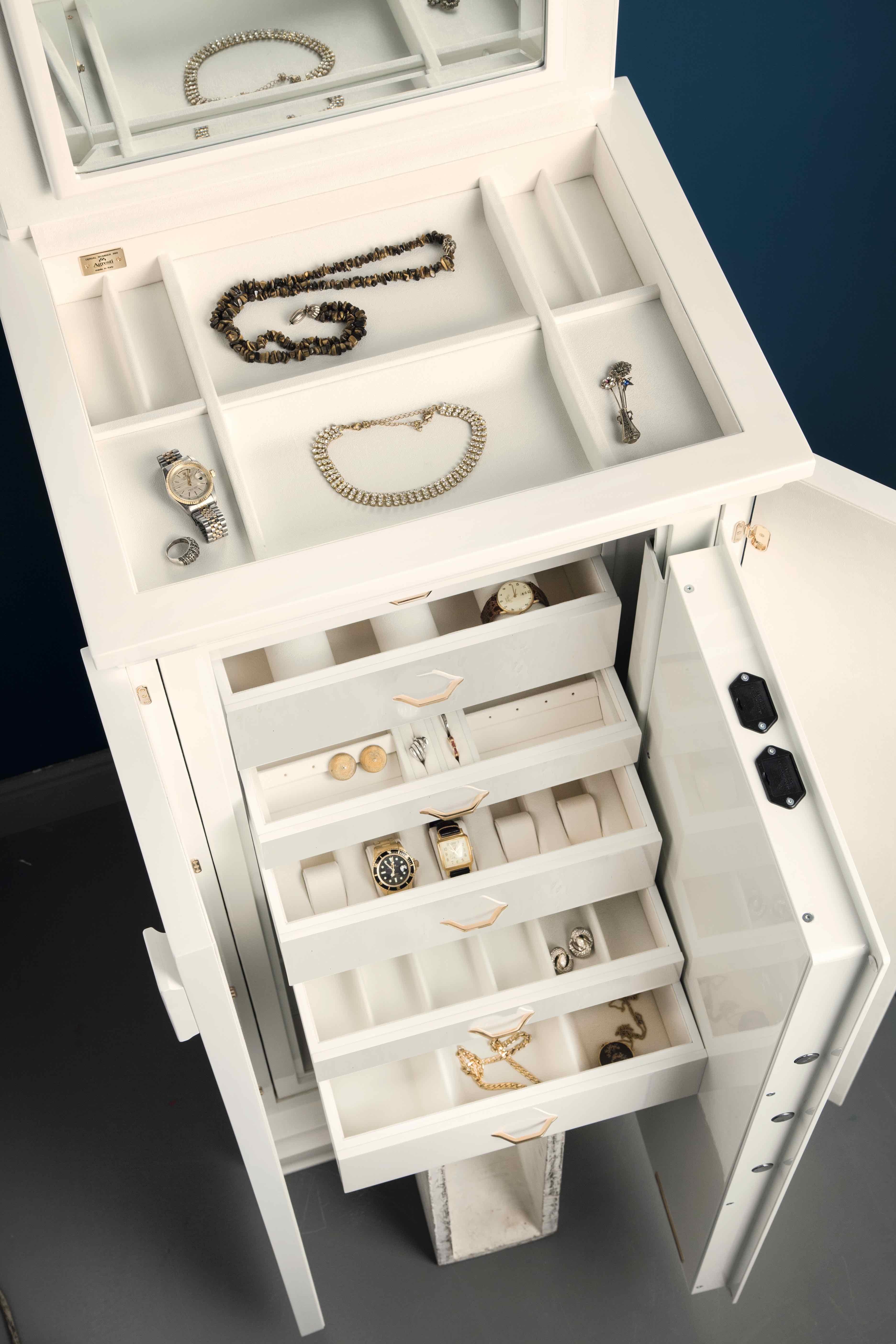 Polished white bird's eye maple contemporary armoured armoire by Agresti.

24-karat gold-plated accessories. Round handle with biometric opening device and emergency key integrated. Inside pull out necklace holder and drawers lined for jewelry.