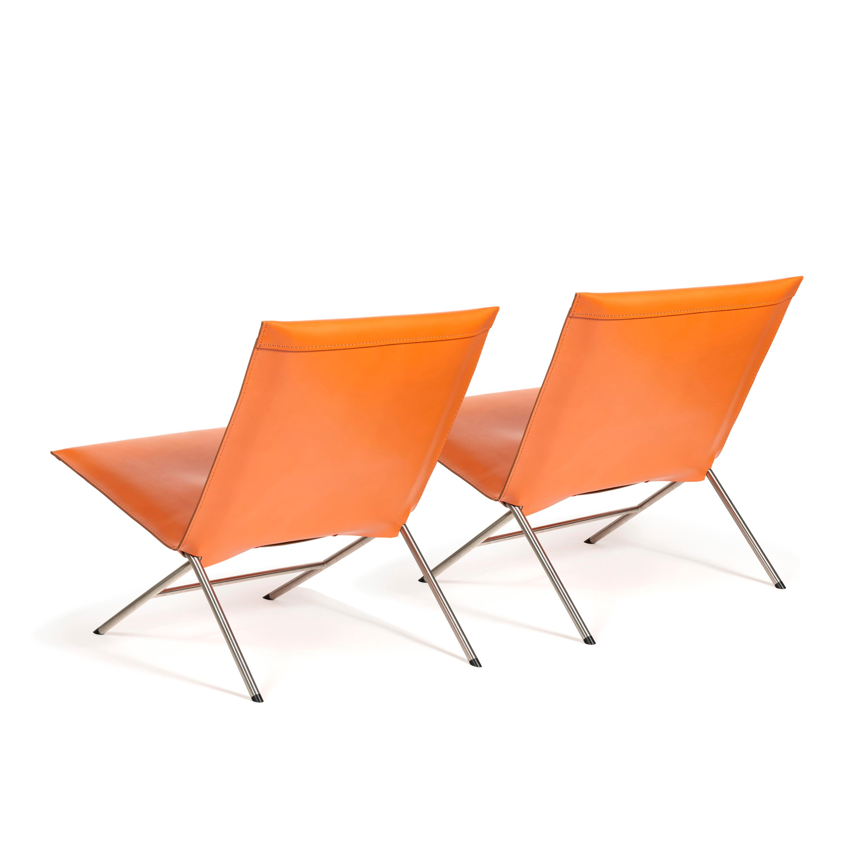 Gioia Meller-Marcovicz.

Recline

A stainless steel and Arancio leather foldable pair of lounge chairs.
Each with a rectangular back and seat covered with dyed leather on a stainless folding structure issuing four cylindrical feet.
Made in
