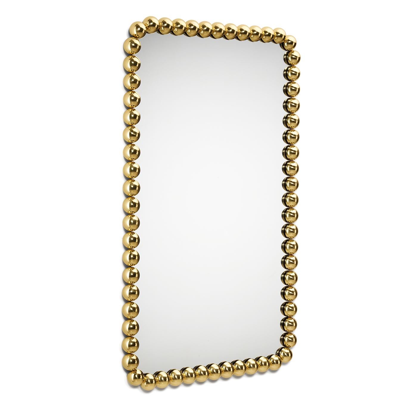Placed above a bathroom sink, an accent table, or a vanity in luxe modern homes, this stylish mirror by Nika Zupanc will strike with its distinctive jewel-like allure. An array of golden-finished brass beads encircles the contours of the mirrored