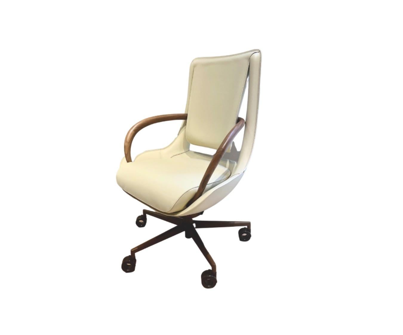 Designed by M2ATELIER

Clip executive office armchair in Ivory Saddle Leather with back structure in profiled steel, seat in Polimex (composite polyester/polyurethane material), and armrest in solid walnut Canaletto wood.
The castors, the base, and