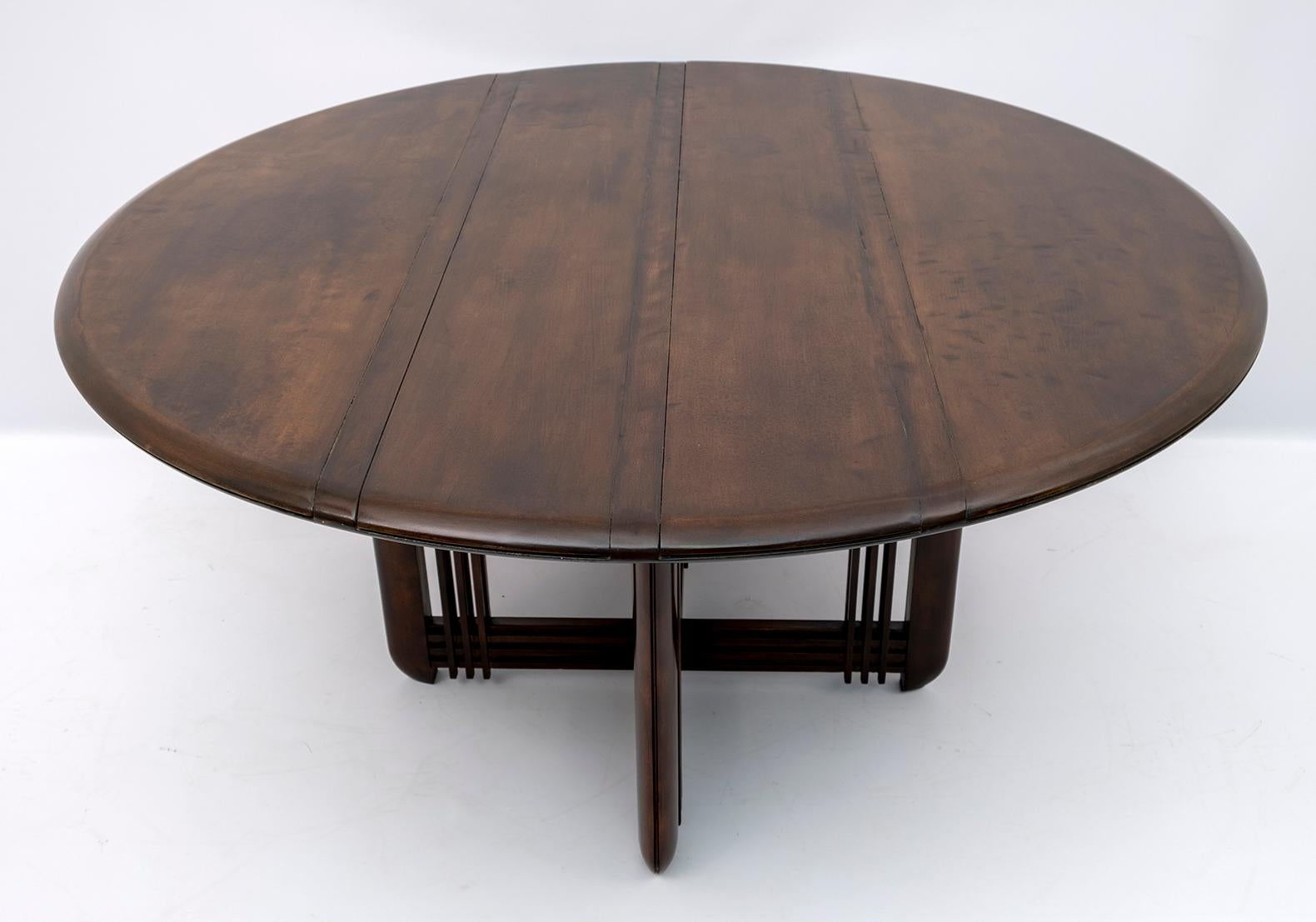 This dining table is in walnut-stained solid beech, handcrafted with a worn effect, created specifically.

Founded by Luigi Giorgetti in 1898 in Brianza, the Italian design and furniture company Giorgetti stands out for its sober and elegant