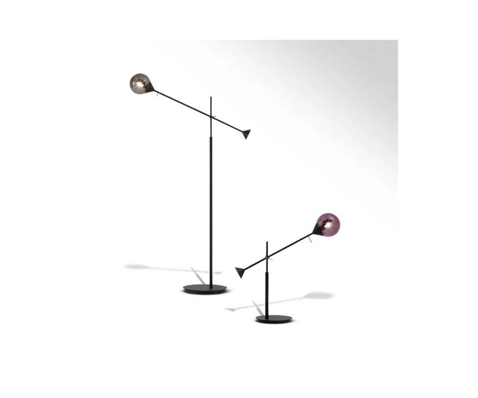 The new Kendama Floor Lamp showcases a striking blend of burnished metal and hand-blown Murano glass spheres. A true fusion of expert craftsmanship and modern elegance, it brings a refined touch to any interior.

Finishes: Black Structure, Bronze