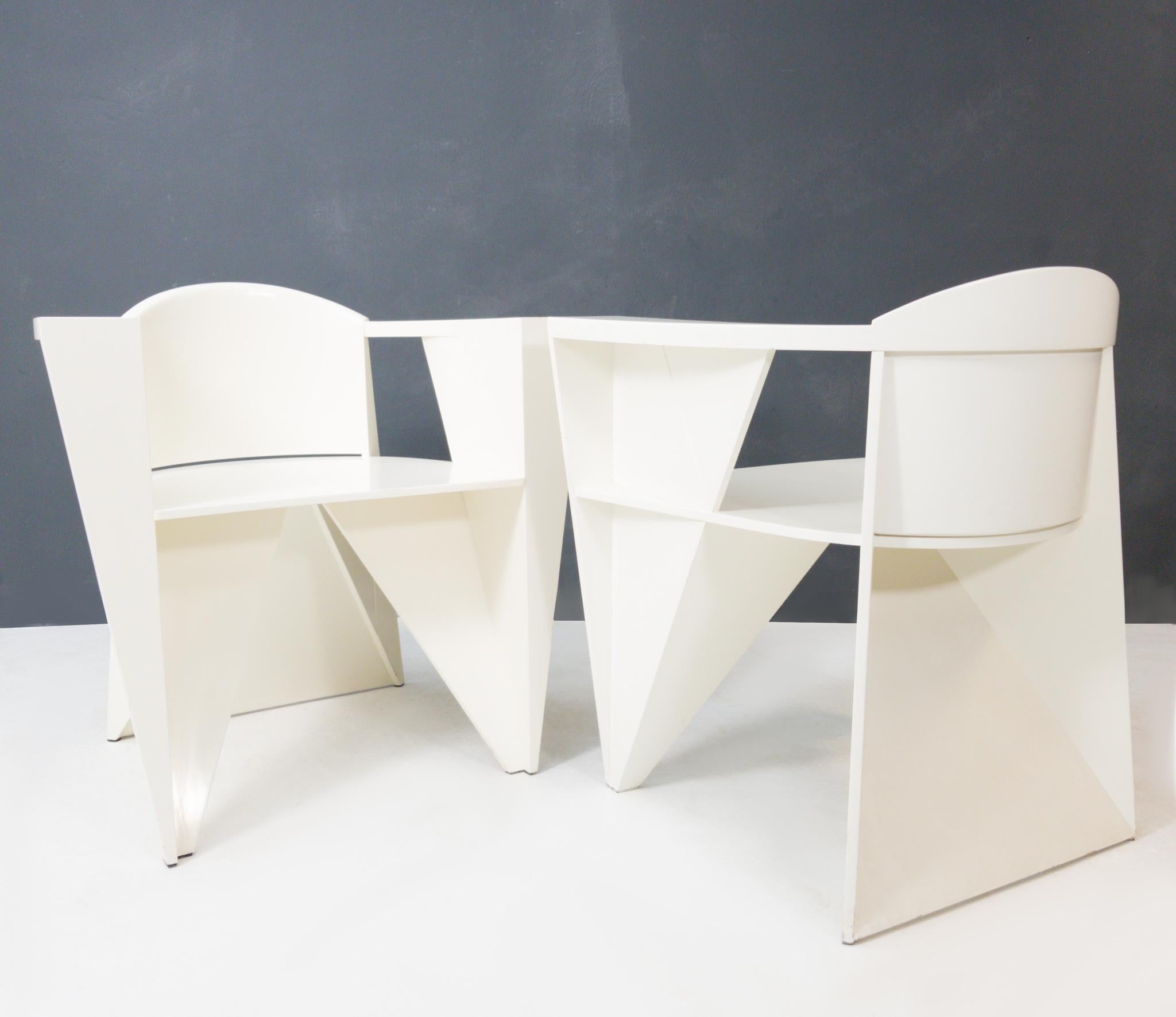 Fantastic shaped Postmodern armchairs designed by Adriano & Paolo Suman, manufactured by Giorgetti Spa, Italy 1984. These chairs are from the Matrix series designed in 1984. Very nice constructivist chairs made of beech plywood, white lacquered.