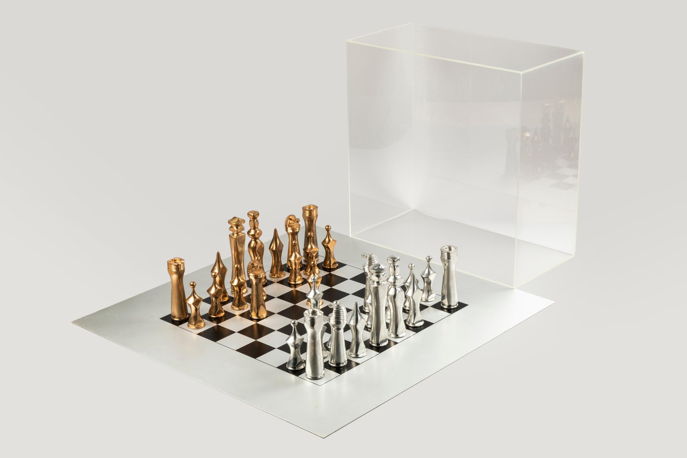 A large and grandiose chessboard, the tray is in aluminium, the figures are made off solid gilt bronze and silver bronze. Giorgio Amelio Roccamonte was borned in Argentina where he met Lucio Fontana who admired Riccamonte vision of art (new