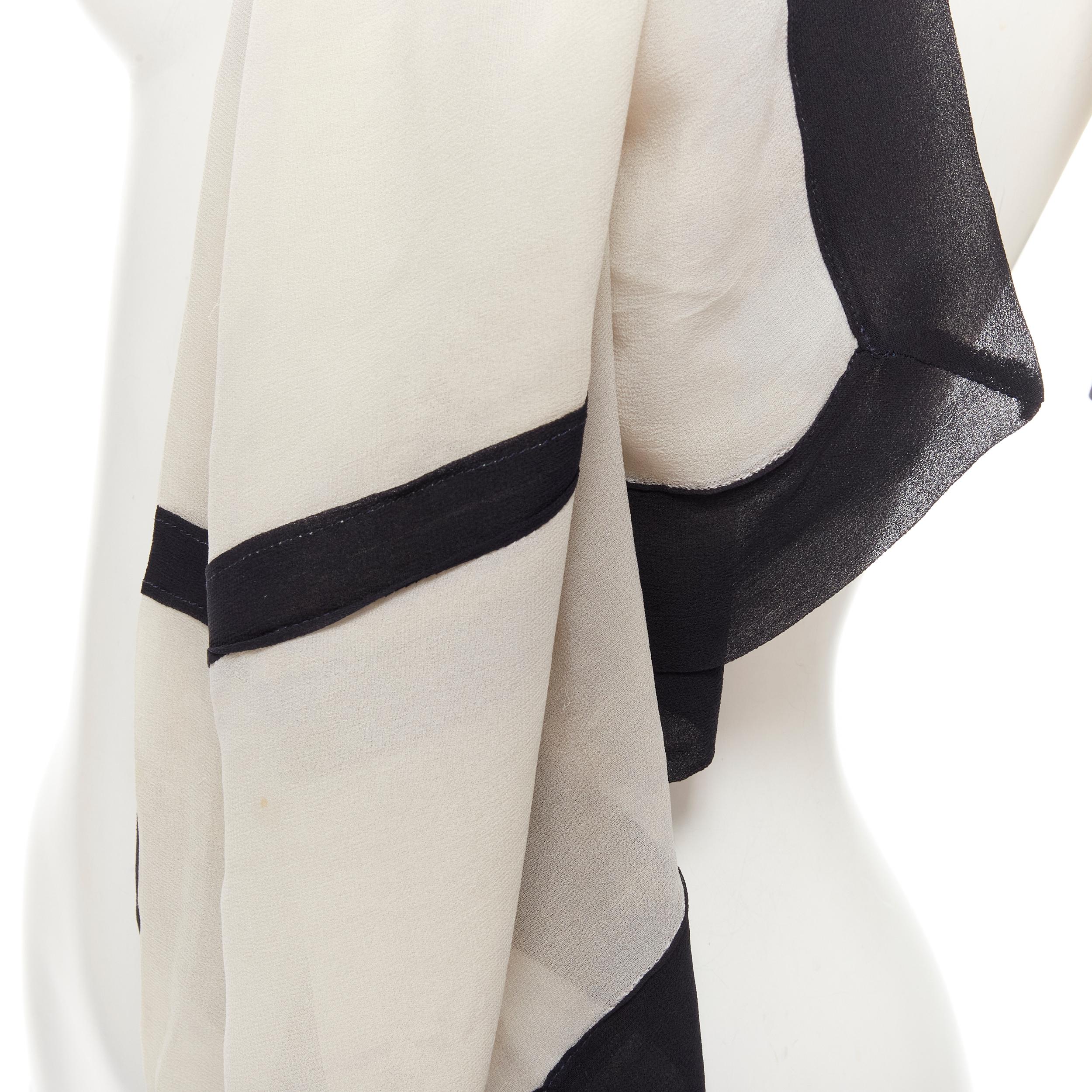 GIORGIO ARMANI 100% silk cream black trim large scarf 
Reference: AEMA/A00089 
Brand: Giorgio Armani 
Material: Silk 
Color: White 
Pattern: Solid 
Made in: Italy 

CONDITION: 
Condition: Excellent, this item was pre-owned and is in excellent