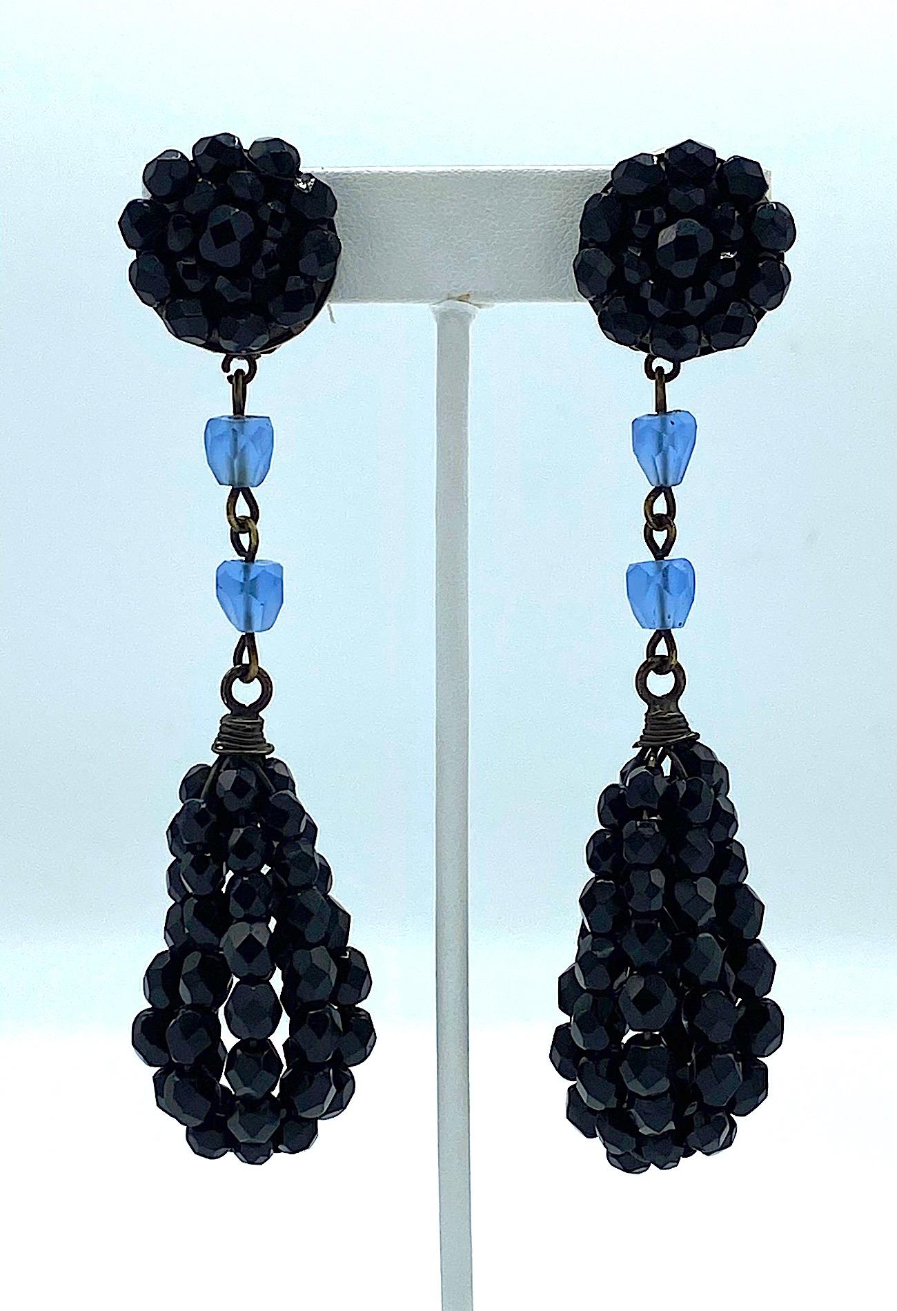 An incredibly elegant pair of Giorgio Armani black crystal bead pedant earrings from the 1980s. The top button is comprised of black crystal beads .88 of an inch in diameter with a clip back. The back of one earrings has a rectangular signature