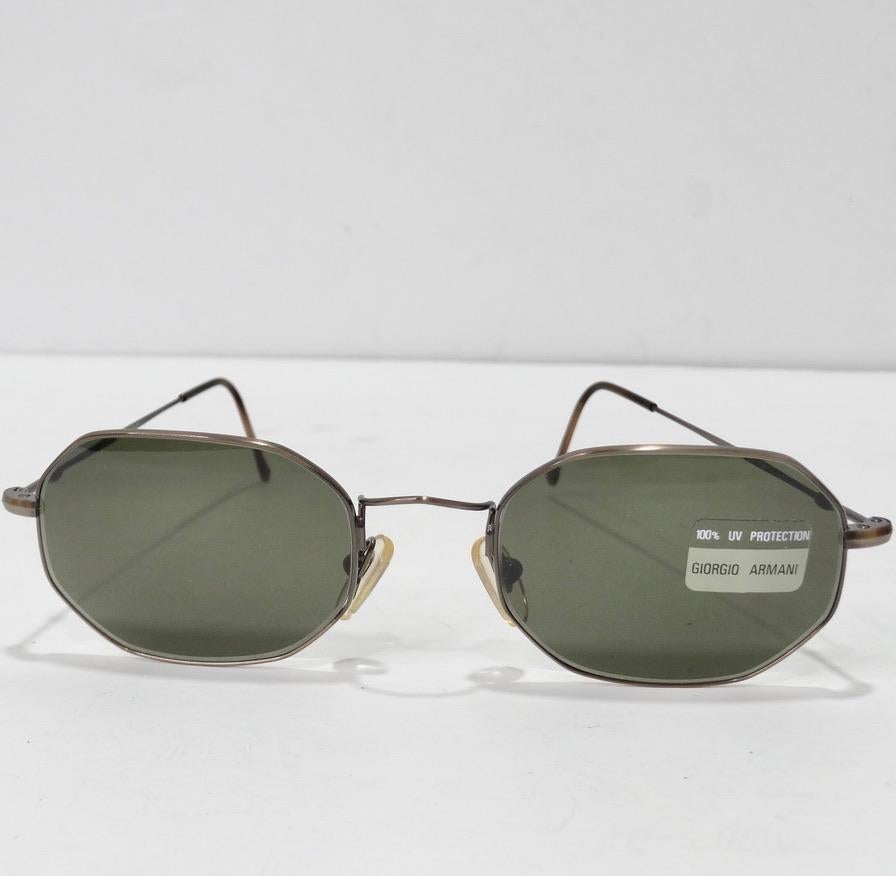 Elevate your eyewear this summer with these beautiful Giorgio Armani dead stock sunglasses circa 1990s! The perfect every day sunglasses featuring neutral green tone lenses accompanied by brown and gold tone detailing. These are so timeless and