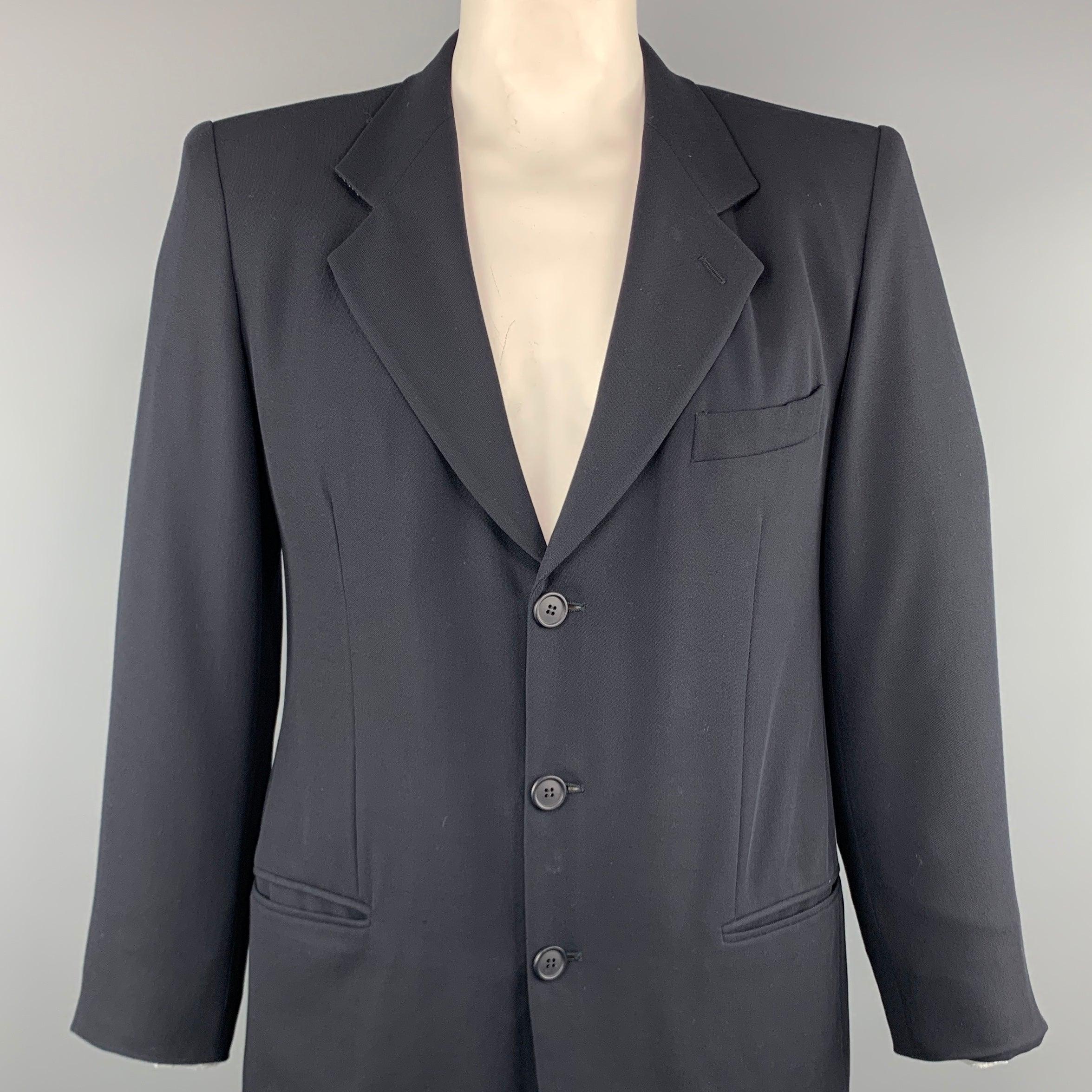 GIORGIO ARMANI LE COLLEZIONI sport coat comes in a navy wool featuring a notch lapel style, slit pockets, and a three button closure. Made in Italy.
Excellent
Pre-Owned Condition. 

Marked:   40 

Measurements: 
 
Shoulder: 16.5 inches 
Chest: 41