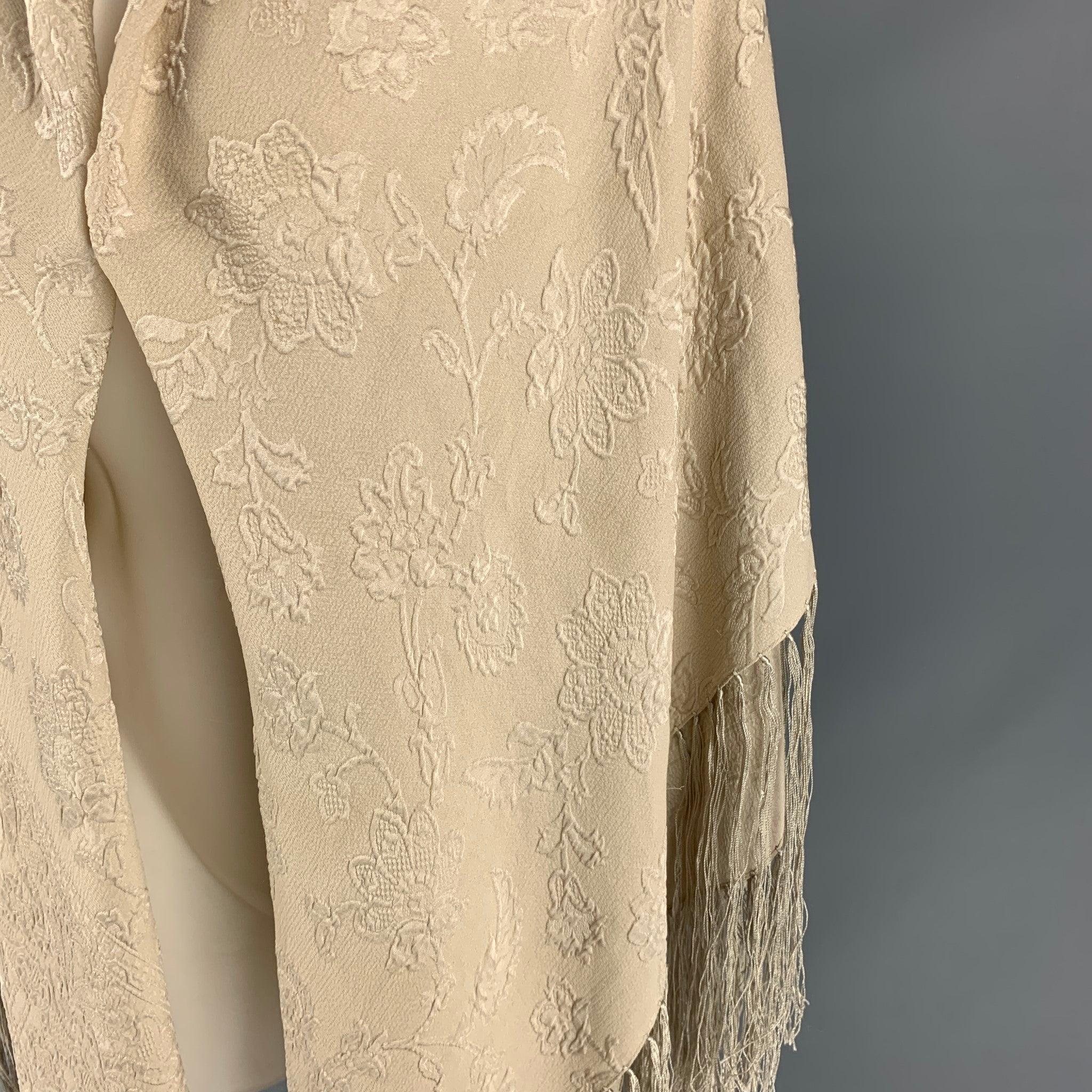 GIORGIO ARMANI shawl comes in a beige jacquard silk with a a nine inch trim. Made in Italy.
 Good
 Pre-Owned Condition. Moderate discoloration throughout.  
 

 Measurements: 
  
 52 inches x 60 inches 
  
  
  
 Sui Generis Reference: 111605
