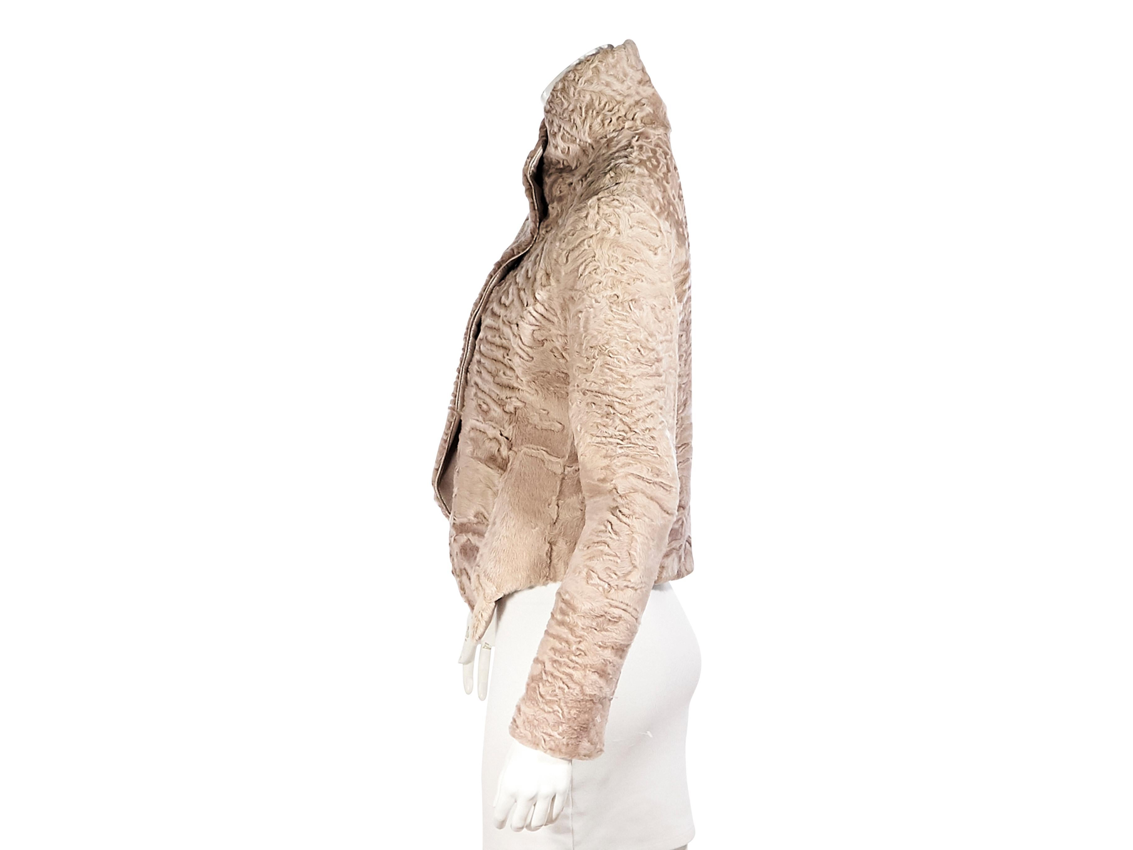 Product details:  Beige curly lamb fur cropped jacket by Giorgio Armani.  Stand collar.  Long sleeves.  Concealed snap-front closure.  Label size IT 40.  40