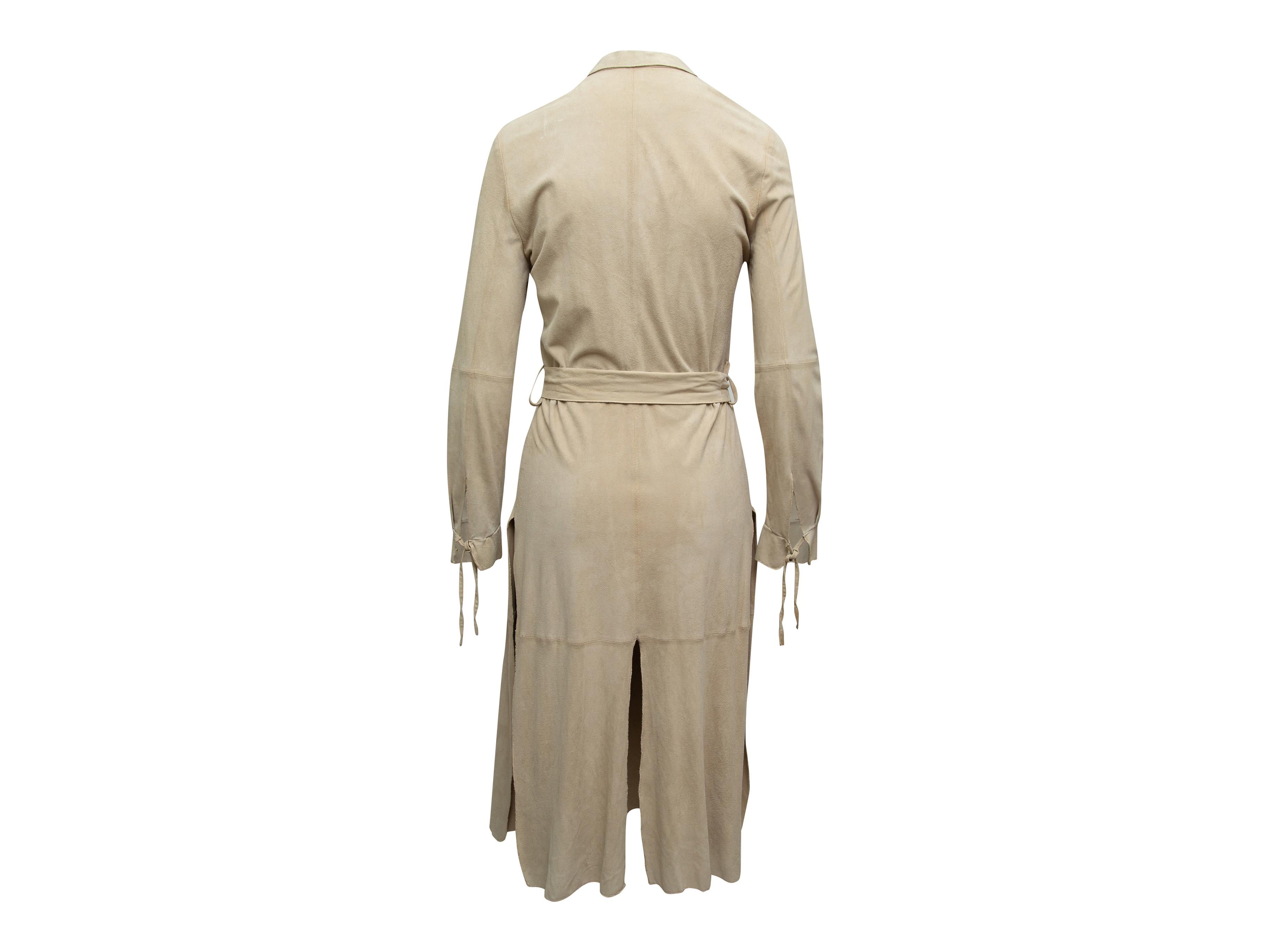 Product details: Beige long suede coat by Giorgio Armani. Tonal stitching throughout. V-neck. Slits at sides and back hem. Tie closure at waist. Designer size 40. 38
