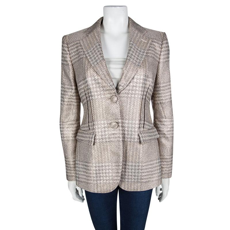 Chic, and very modern, this blazer from Giorgio Armani will make others gasp in admiration.The fabulous beige blazer is made from a polyester blend and it features a structured silhouette. It flaunts a collar, long sleeves, and button fastenings