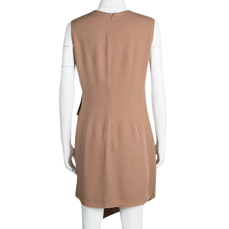 Elegant and stylish, this dress from Giorgio Armani comes ready to give you a high-fashion look. Made from silk, it flaunts draped pleat details and an asymmetric bottom. A pair of beige slides will complete your look beautifully.

Includes: The
