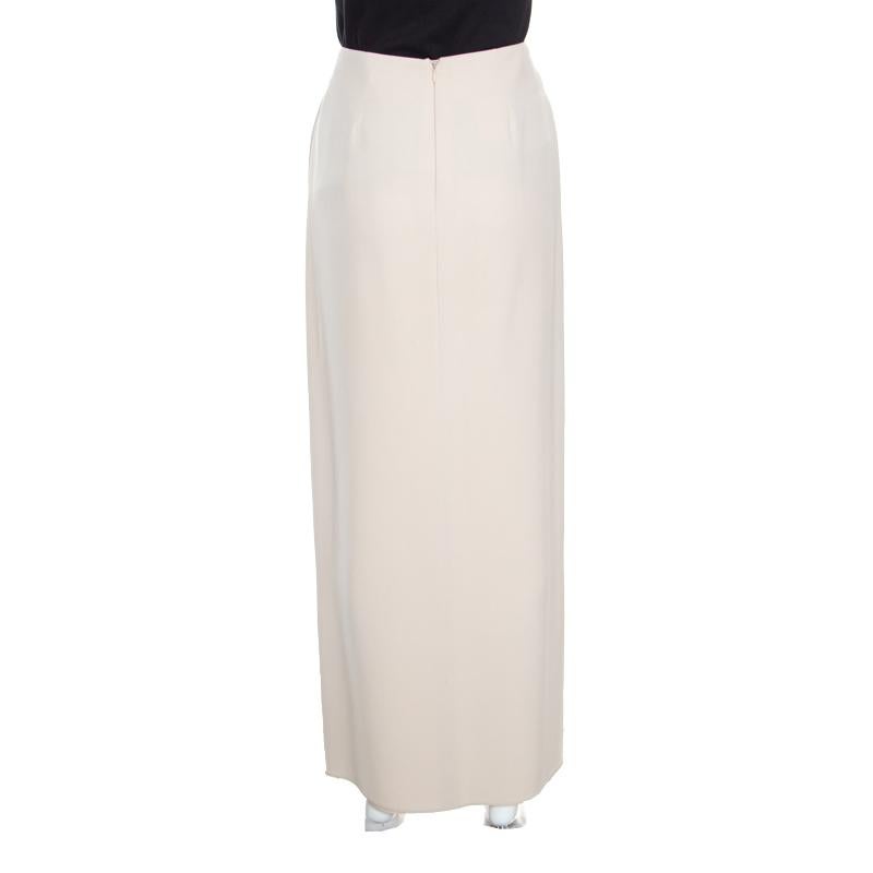 Go for this trendy and chic skirt from Giorgio Armani to add an exclusive touch of magic to your appearance. It is made of 100% silk and features a front pleated silhouette. It comes equipped with a concealed zip closure at the back and can be