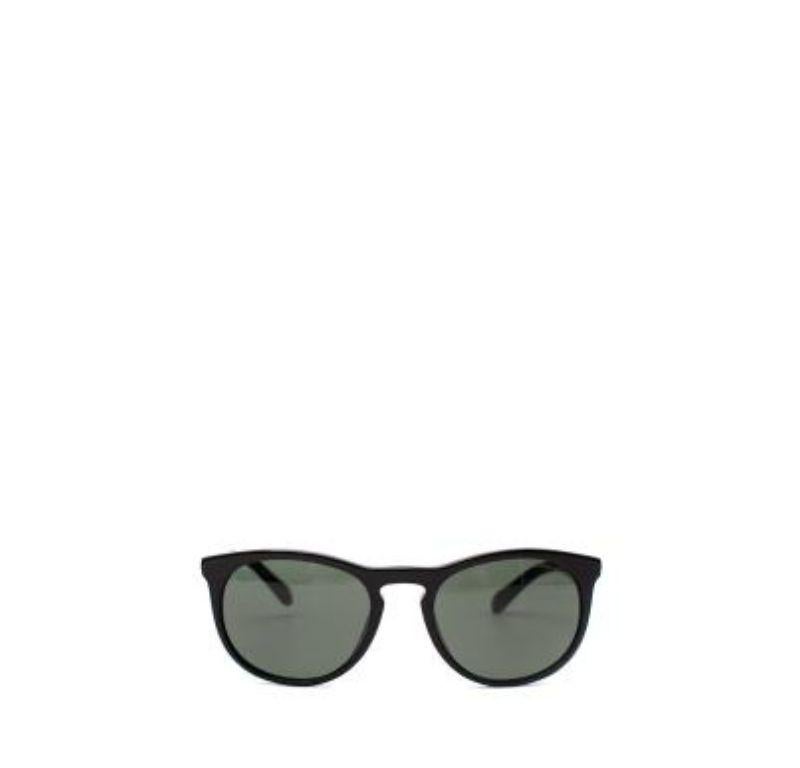 Giorgio Armani Black Acetate Circular Frame Sunglasses

- Simple, black circular acetate frames
- Green-grey tinted lens 
- Logo on the temple 

Made in Italy
Use soap and water to clean

PLEASE NOTE, THESE ITEMS ARE PRE-OWNED AND MAY SHOW SIGNS OF