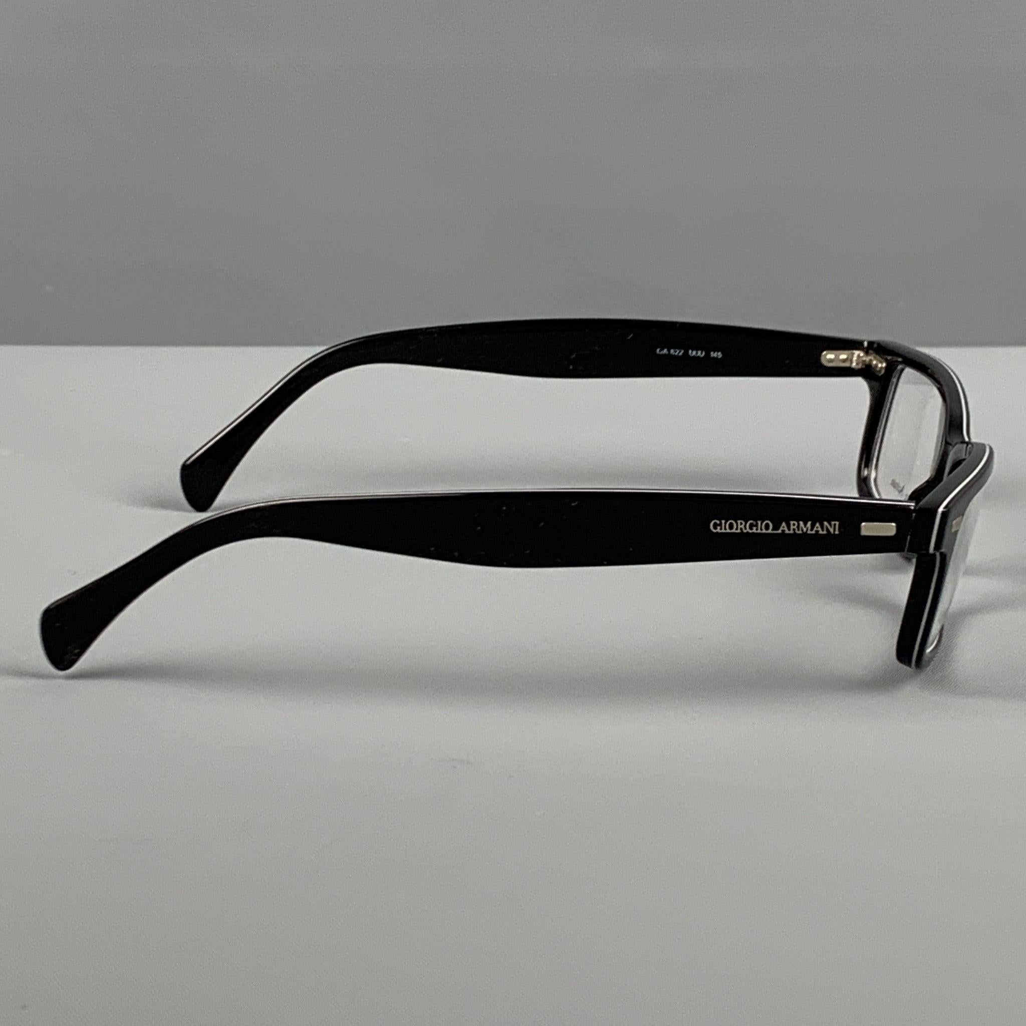 GIORGIO ARMANI frames comes in a black acetate with silver tone accents. Made in Italy.
 Very Good
 Pre-Owned Condition. 
 

 Marked:  GA 822 UUU 145 
 

 Measurements: 
  Length:
 13.5 cm. Height: 3.5 cm.
  
  
  
 Sui Generis Reference: 85115

