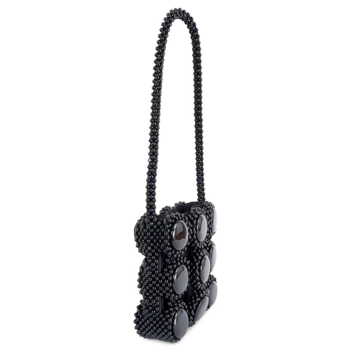 100% authentic Giorgio Armani evening shoulder bag embellished with black round beads with a silk satin inside pouch with drawstring closure. Has been carried and is in excellent condition. 

Measurements
Height	18cm (7in)
Width	18cm (7in)
Depth	5cm
