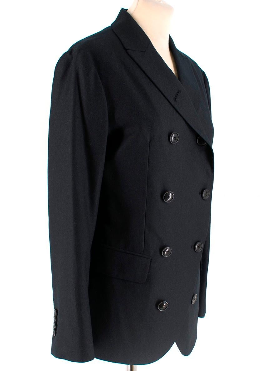 Double Breasted Blazer from Giorgio Armani. Features two front pockets and a striped, navy lining. 

- Made in Italy 
-  100% Wool
- Lining: 51% Viscose, 49% Acetate 
Measurements are taken laying flat, seam to seam. 

Shoulders 42 cm
Sleeves 55