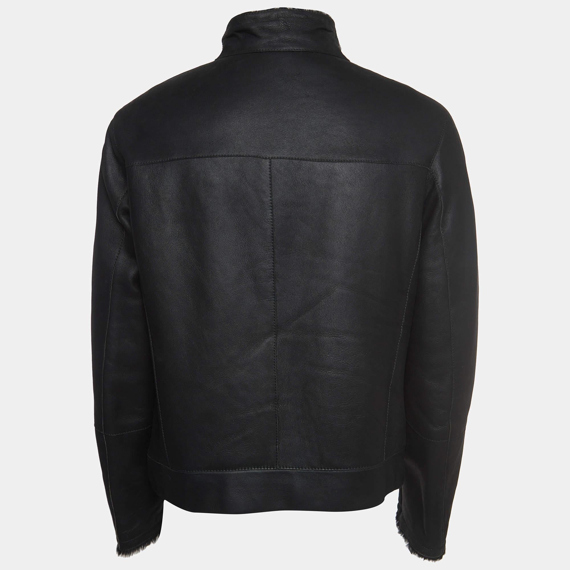 The Giorgio Armani jacket exude sophistication and luxury. Crafted from premium black leather, it features a sleek zipper design and opulent fur detailing. This statement piece seamlessly blends edgy style with timeless elegance, making it a