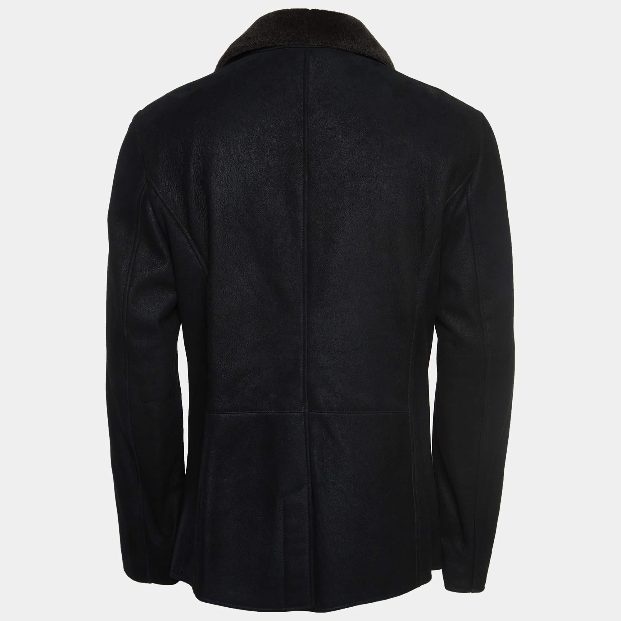 The Giorgio Armani jacket is a sleek and sophisticated outerwear piece that exudes timeless elegance. Crafted from high-quality black leather, it features a double-breasted design, emphasizing a classic yet contemporary style, making it a must-have