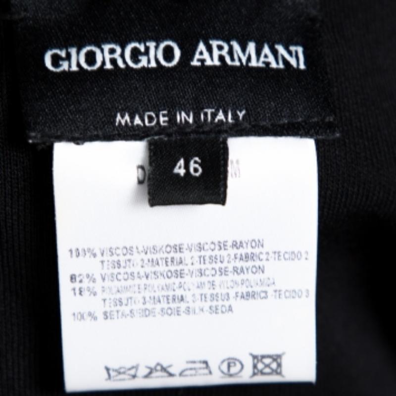 This Giorgio Armani skirt will lend you a girly and polished look. Made from blended fabric, it will complement most of your outfits. It features a flared design at the hem along with a well-styled waistline. This black skirt will look great with a