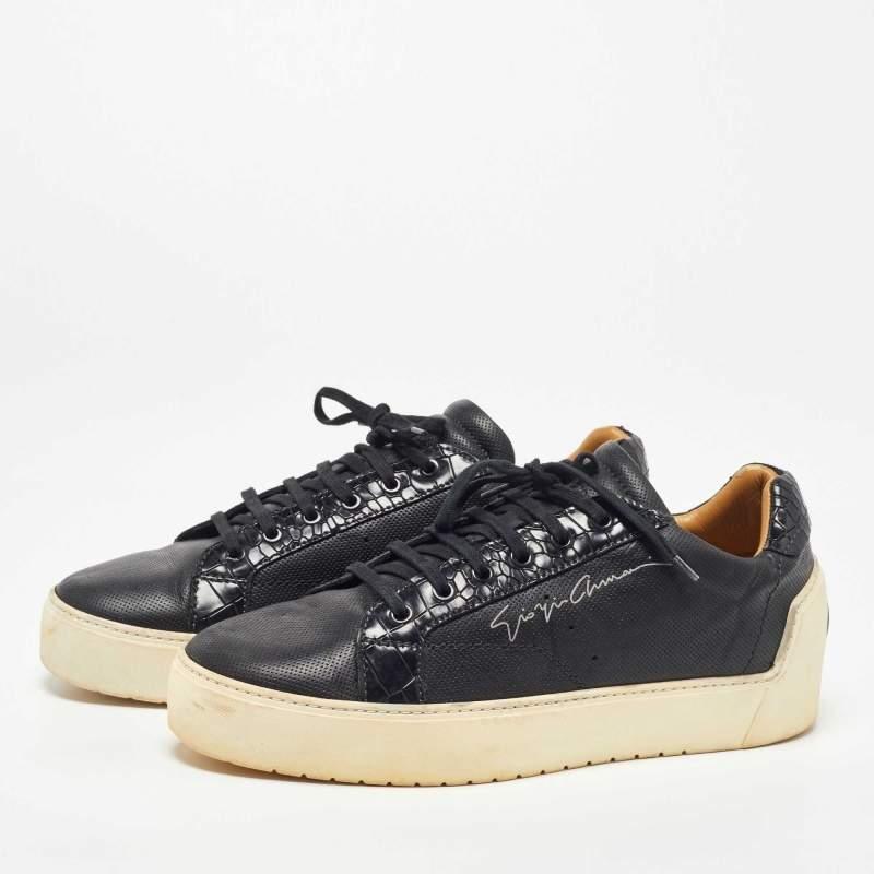 Coming in a classic silhouette, these Giorgio Armani sneakers are a seamless combination of luxury, comfort, and style. These sneakers are designed with signature details and comfortable insoles.